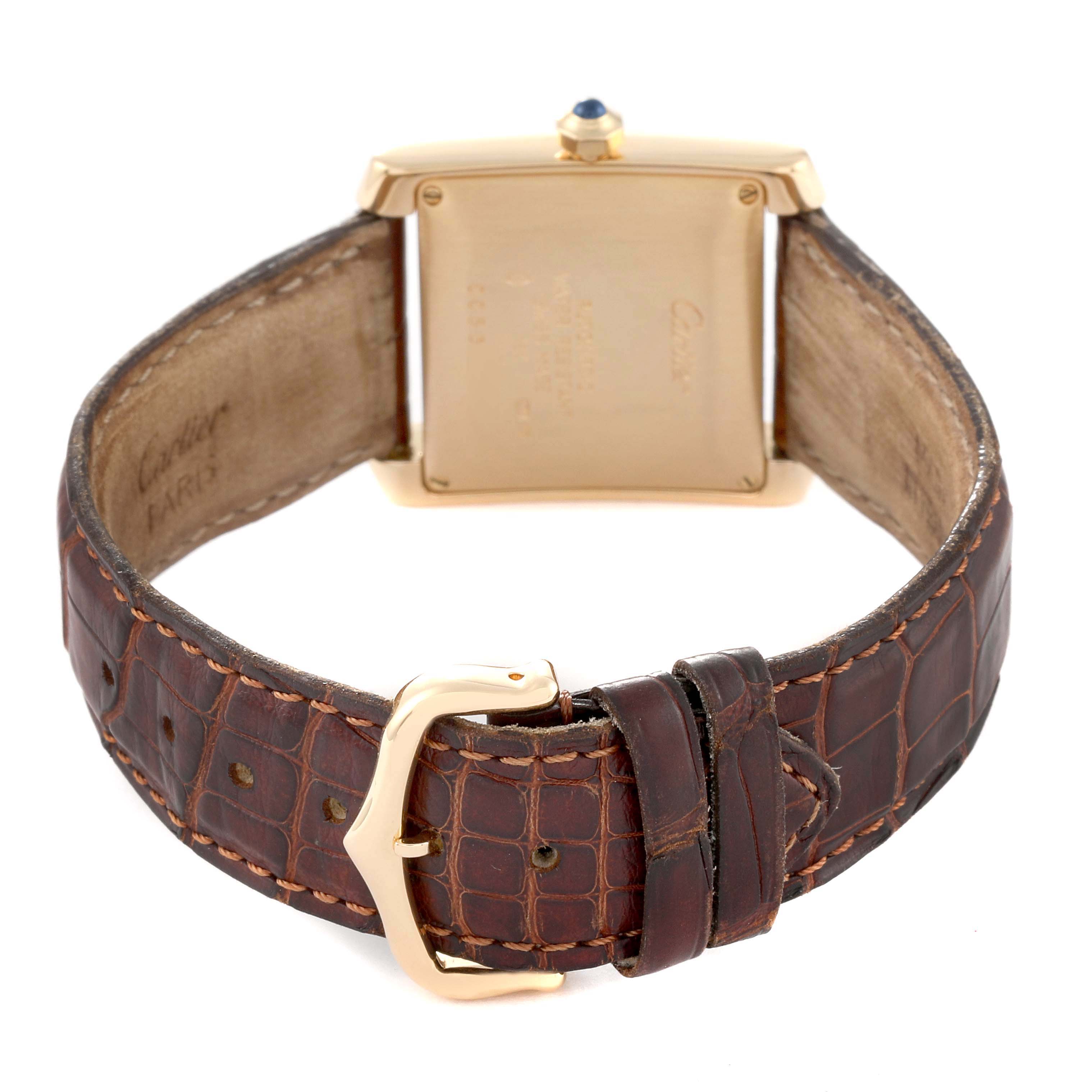 The image shows the back of a Cartier Tank Francaise W5000156 Men
s Yellow Gold Silver Dial W5000156 Men
s Yellow Gold Silver Dial watch, focusing on the case back, leather strap, and buckle.