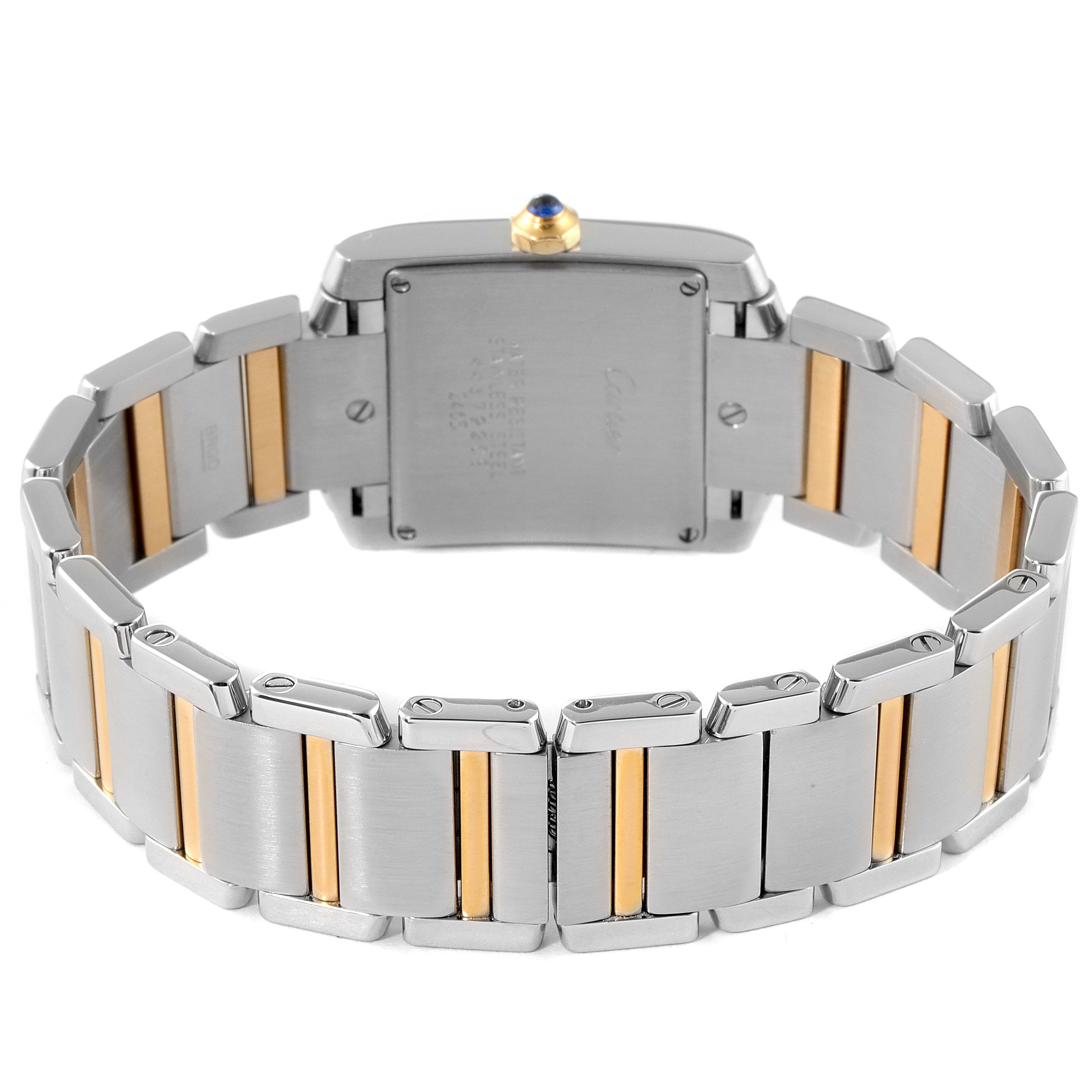 The image shows the back view of a Cartier Tank Française watch, highlighting the bracelet and clasp.