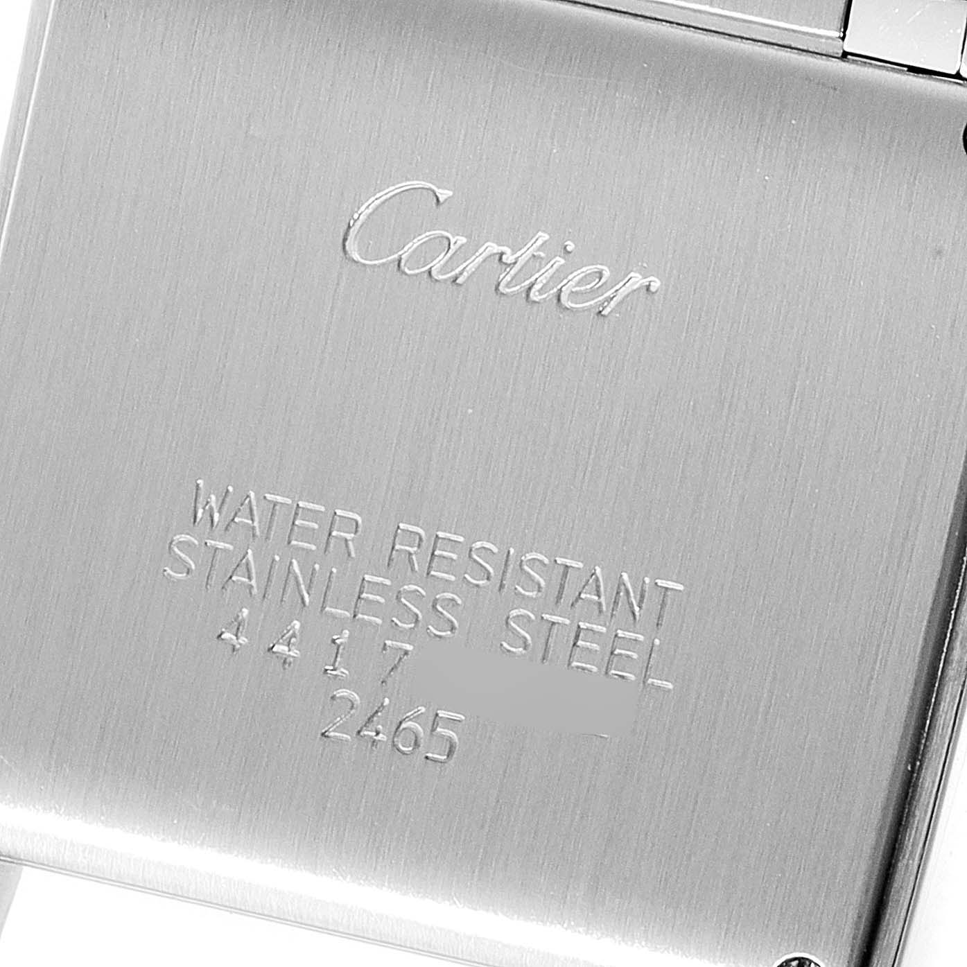 This image shows the stainless steel case back of the Cartier Tank Française watch.