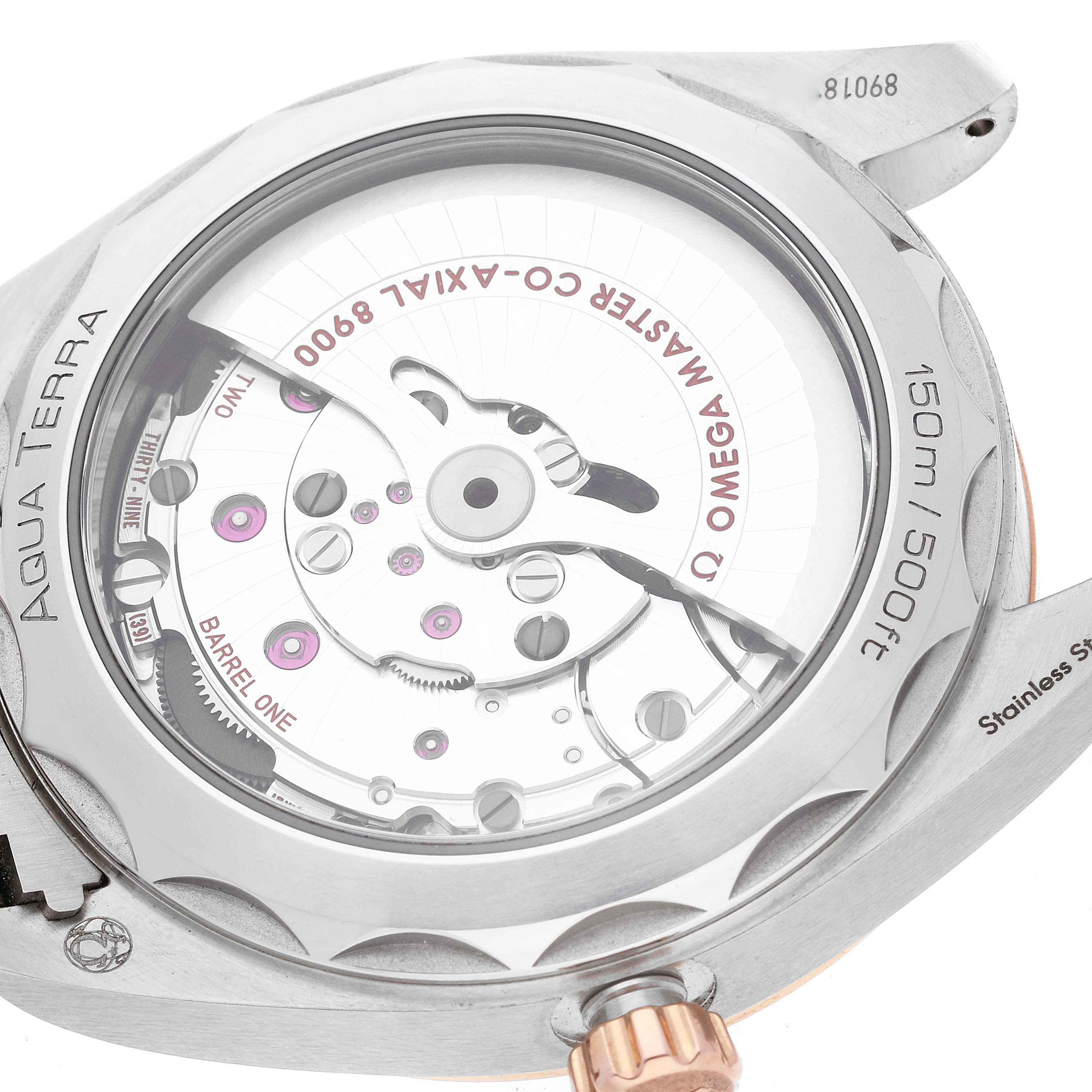 This image shows the transparent case back of the Omega Aqua Terra 220.20.41.21.06.001 Men's Steel and Gold (two tone) Grey Dial 220.20.41.21.06.001 Men's Steel and Gold (two tone) Grey Dial watch, revealing the co-axial 8900 movement.