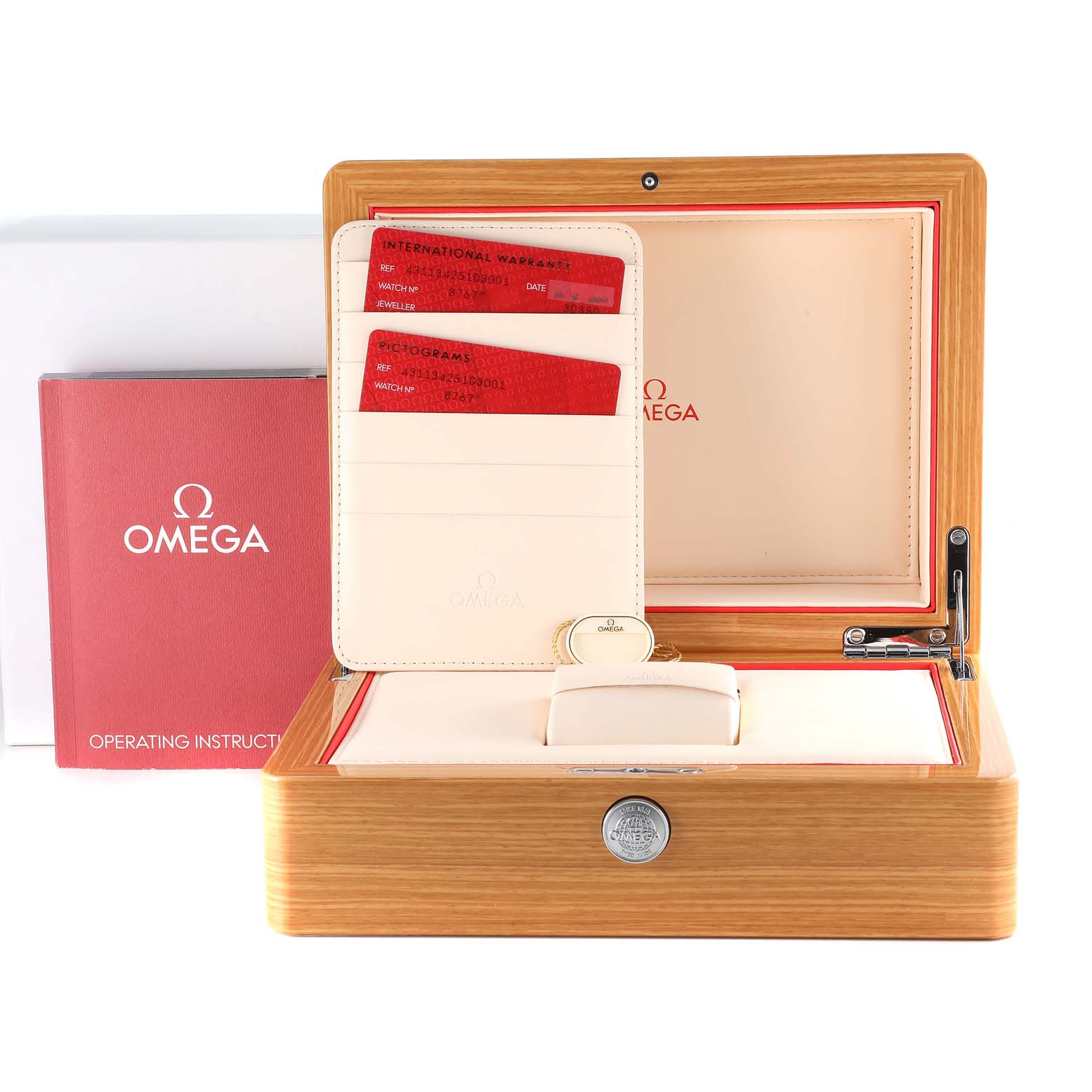 The image shows an Omega De Ville 431.13.42.51.03.001 Men's Stainless Steel Blue Dial 431.13.42.51.03.001 Men's Stainless Steel Blue Dial watch box, warranty cards, and the operating instructions, all arranged at a straight-on angle.