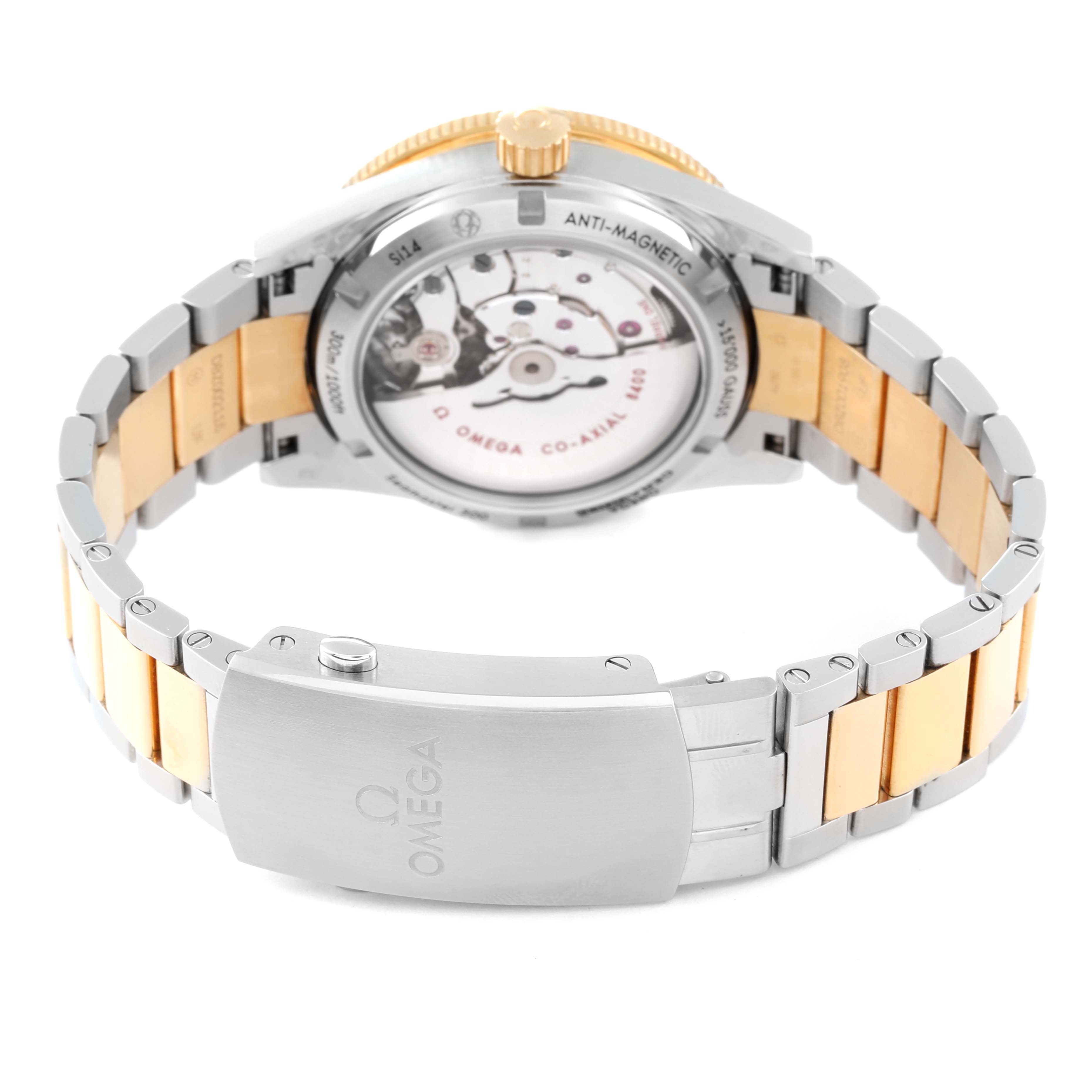 The image shows the back view of the Omega Seamaster 233.20.41.21.01.002 Men's Steel and Gold (two tone) Black Dial 233.20.41.21.01.002 Men's Steel and Gold (two tone) Black Dial, highlighting its movement and two-tone bracelet.