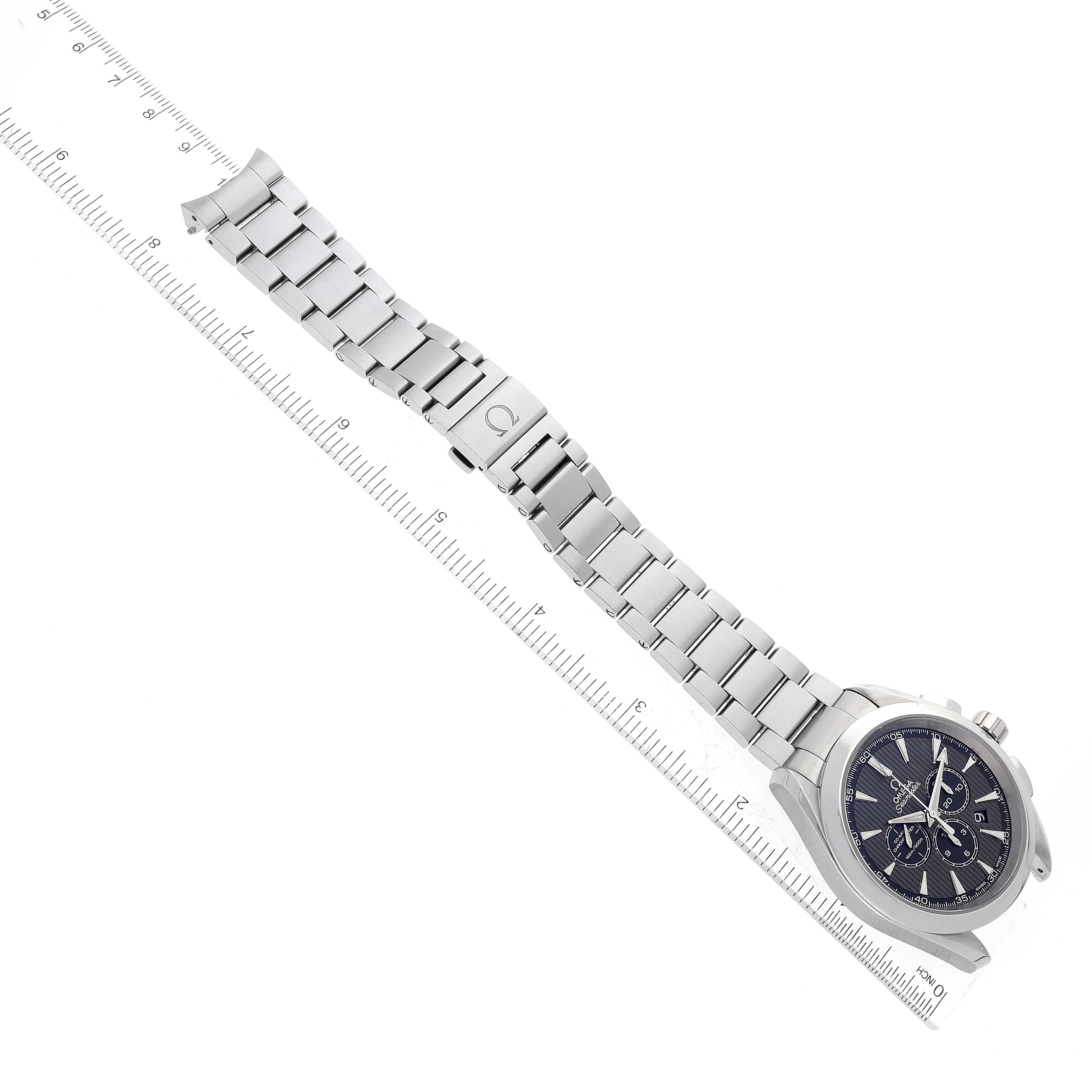 The Omega Aqua Terra 231.10.44.50.06.001 Men
s Stainless Steel Grey Dial 231.10.44.50.06.001 Men
s Stainless Steel Grey Dial watch is photographed from an overhead angle, showing the face, band, and clasp next to a ruler for scale.