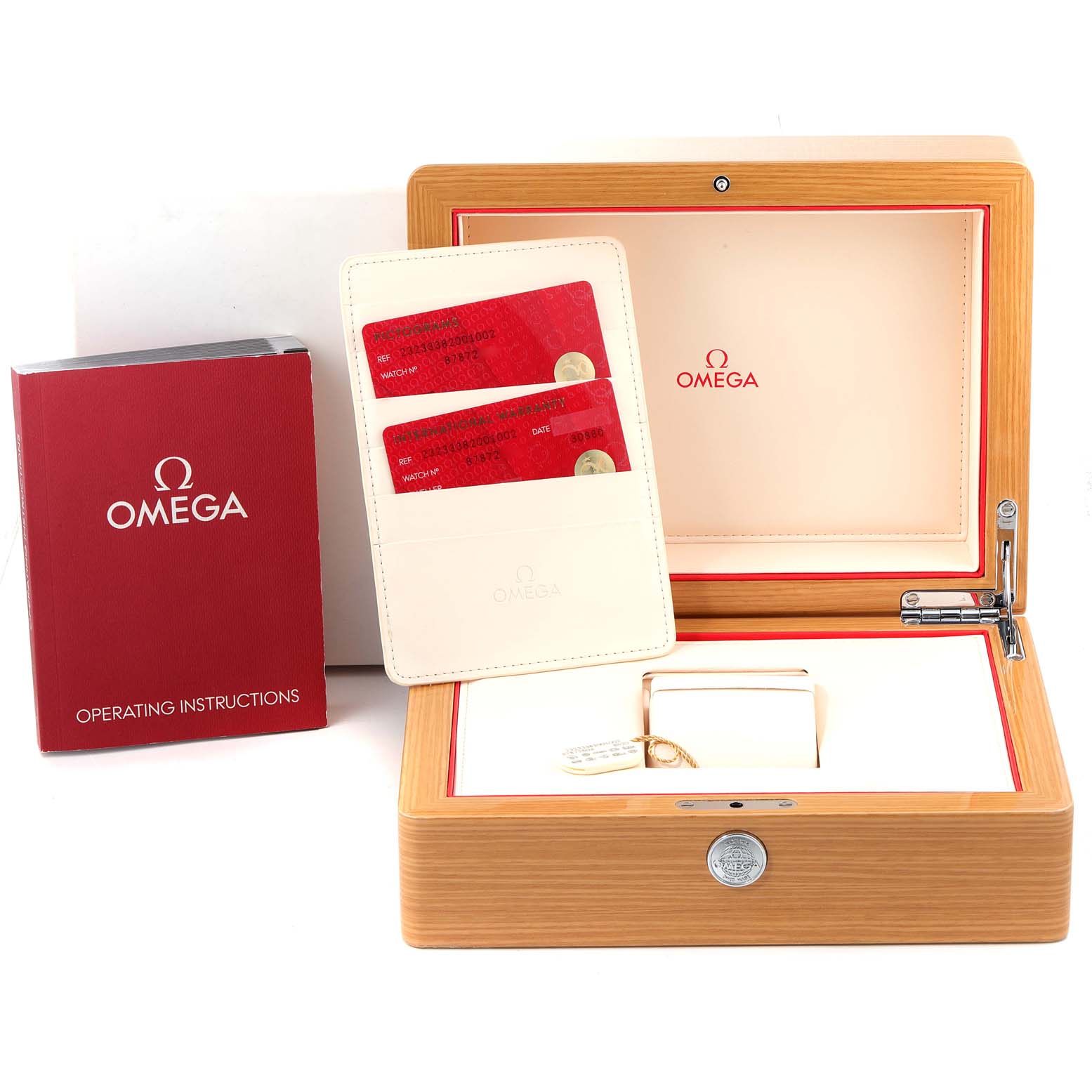 The image shows the packaging of an Omega Planet Ocean 232.33.38.20.01.002 Men
s Stainless Steel Black Dial 232.33.38.20.01.002 Men
s Stainless Steel Black Dial watch, including the box, operating instructions, and warranty cards.