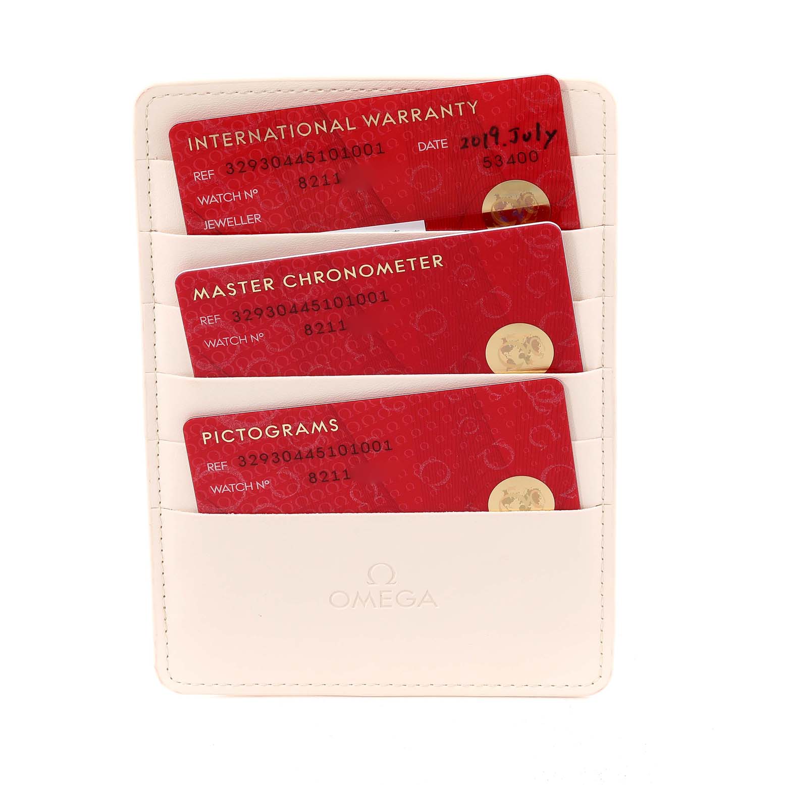 The image shows warranty and certification cards for the Omega Speedmaster 329.30.44.51.01.001 Men's Stainless Steel Black Dial 329.30.44.51.01.001 Men's Stainless Steel Black Dial, placed in a holder at a top-down angle.