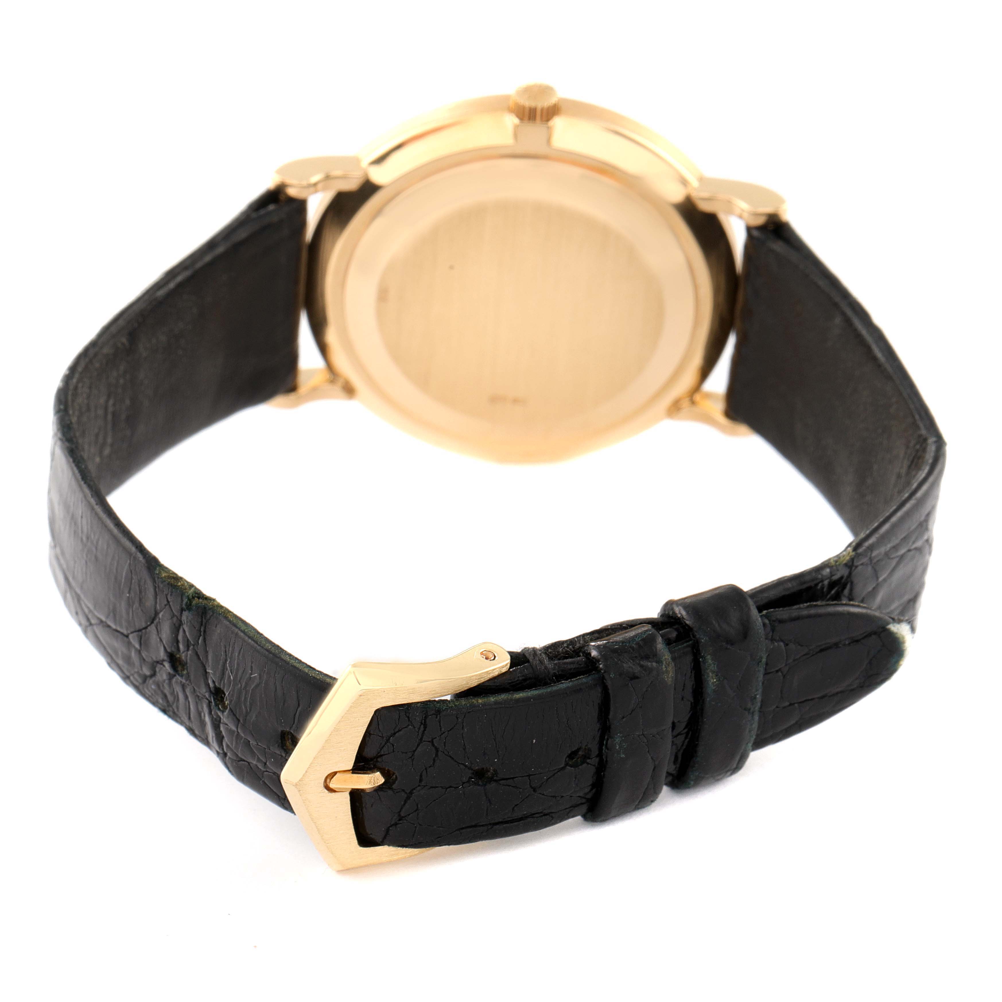 This image shows a rear angle view of the Calatrava model by Patek Philippe, focusing on the caseback and leather strap with buckle.