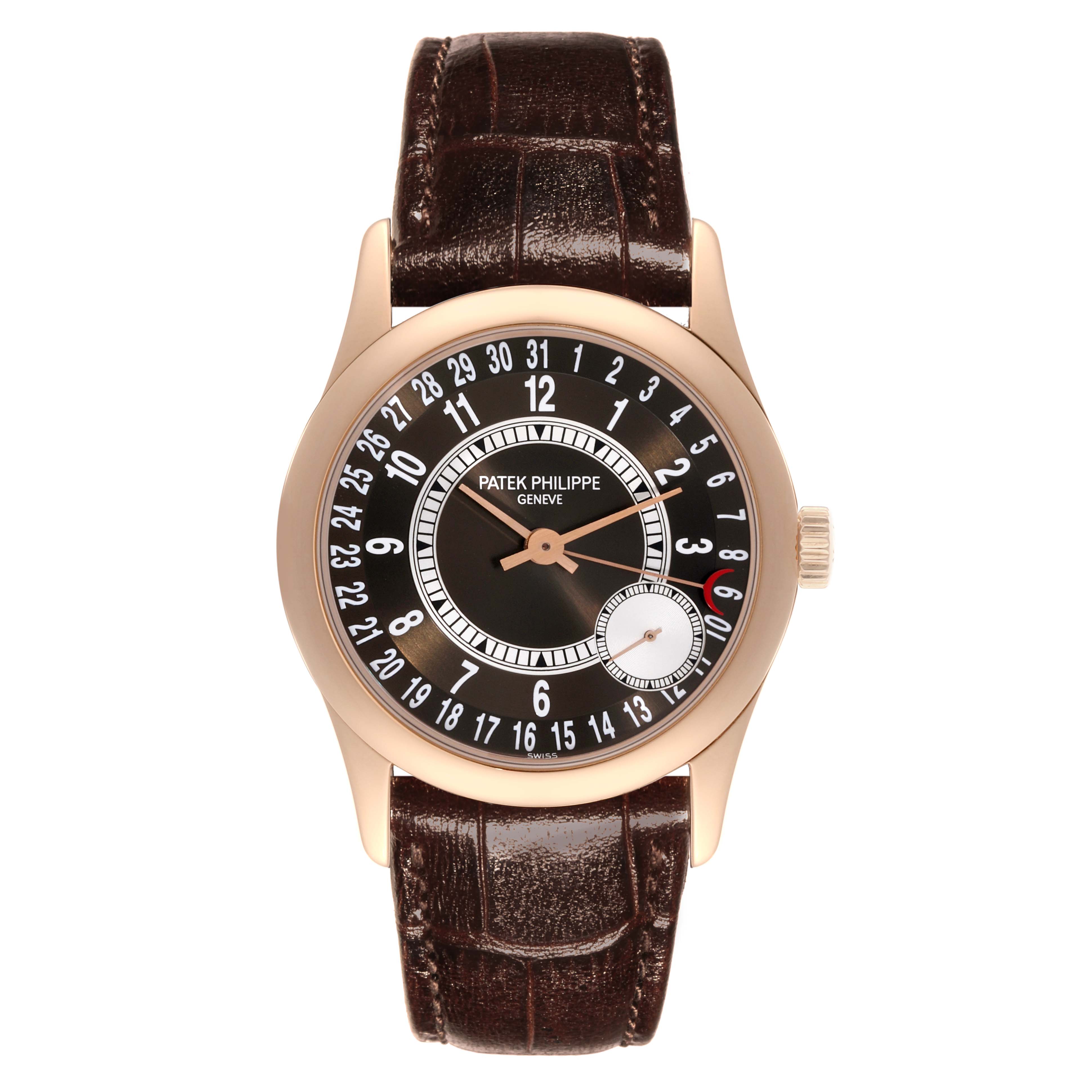 The Patek Philippe Calatrava 6000R-001 Men's Rose Gold Brown Dial 6000R-001 Men's Rose Gold Brown Dial watch is shown from a top-down angle, displaying the face, case, and brown leather strap.