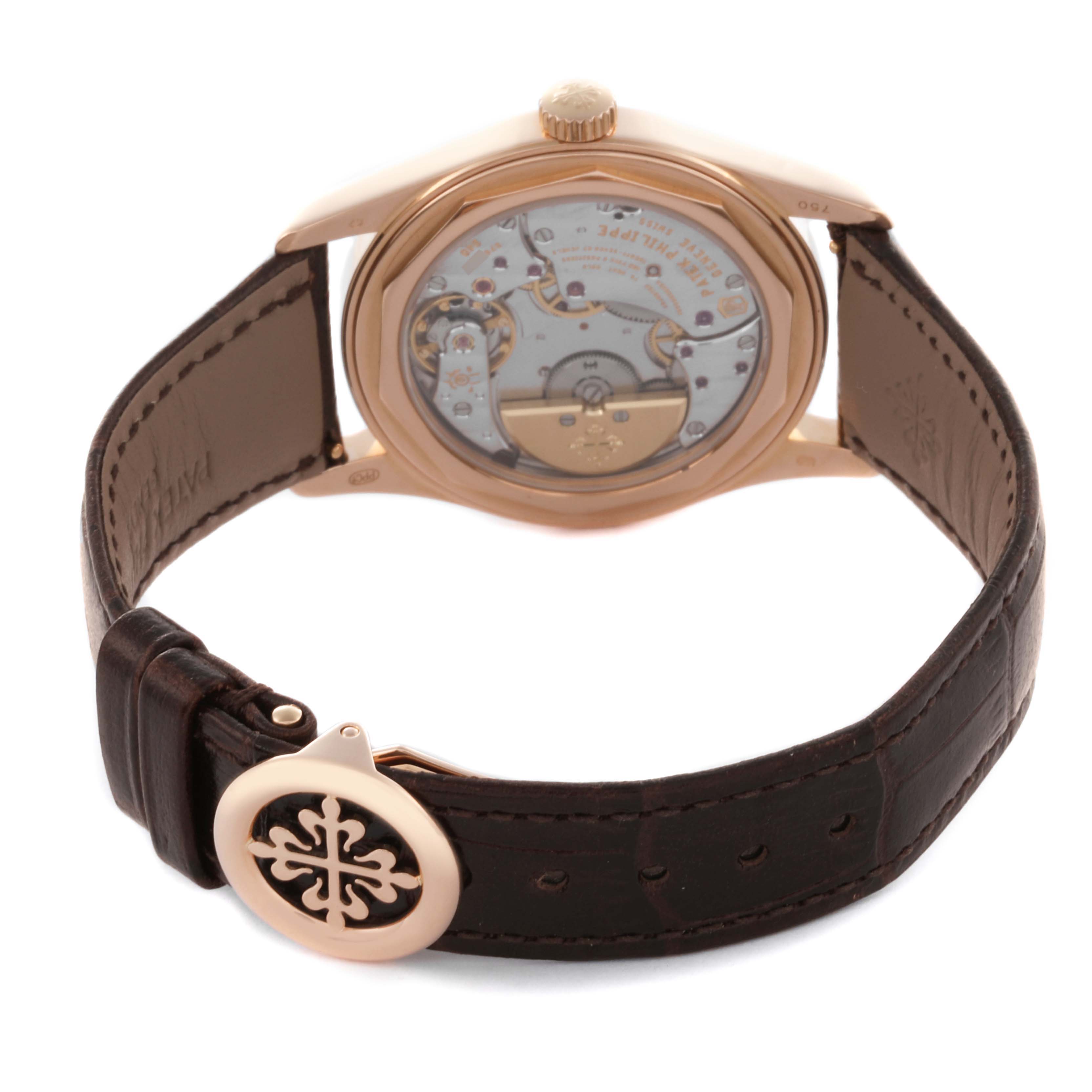 The image shows the back view of the Patek Philippe Calatrava 6000R-001 Men's Rose Gold Brown Dial 6000R-001 Men's Rose Gold Brown Dial, highlighting its movement and leather strap.