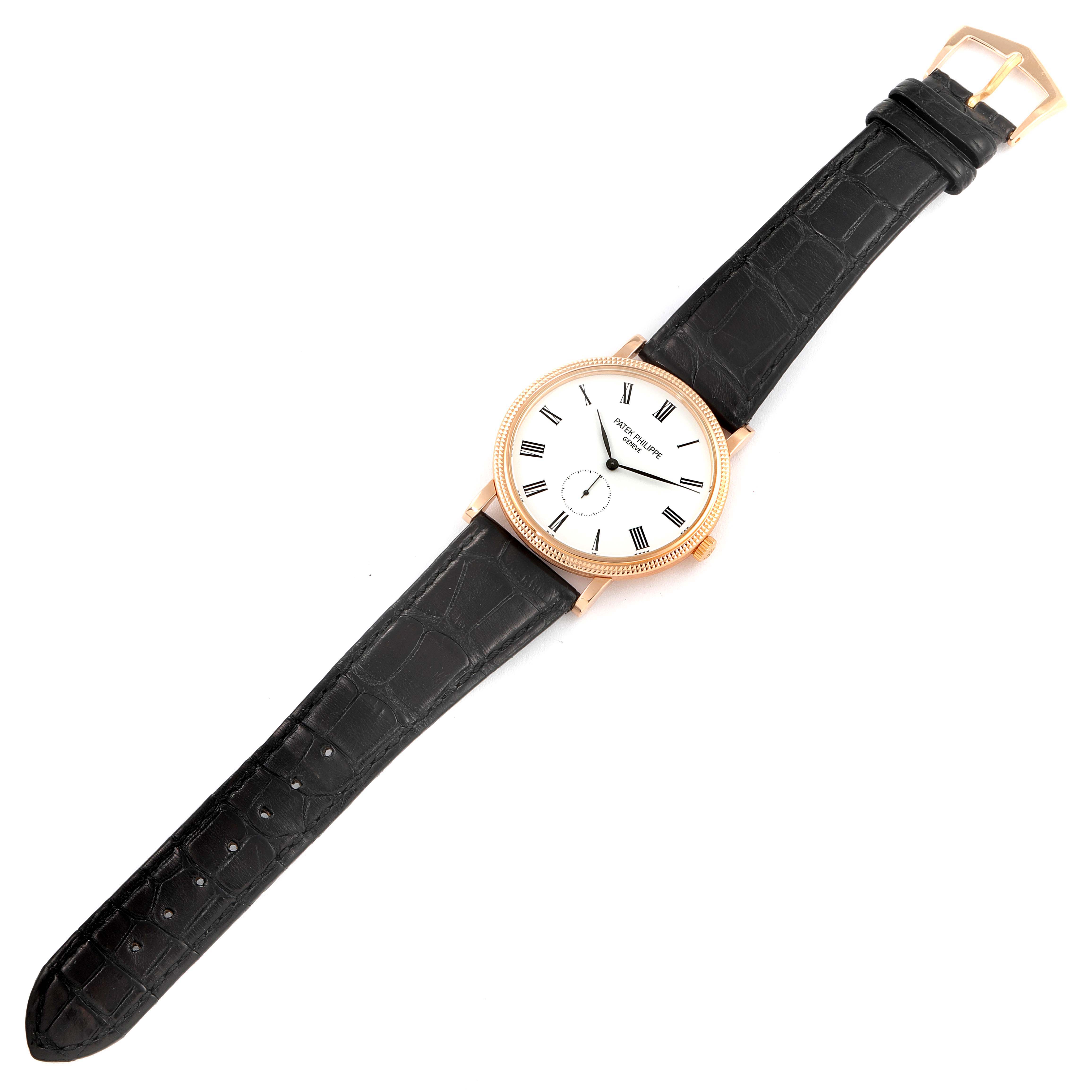 The image shows a Patek Philippe Calatrava 5119R Men's Rose Gold White Dial 5119R Men's Rose Gold White Dial watch lying flat, displaying the face, case, and leather strap with a buckle.