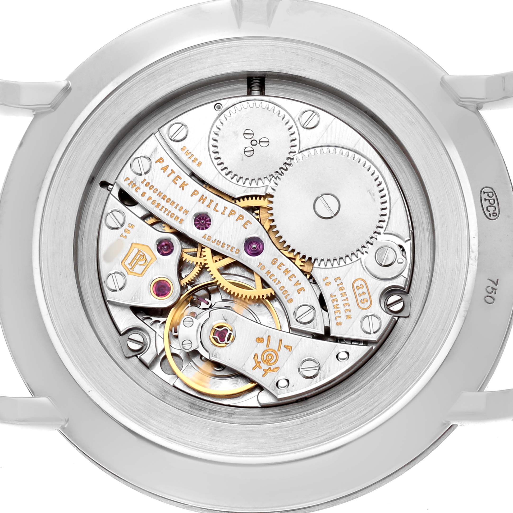 The image shows the movement of a Patek Philippe Calatrava 5119G Men's White Gold White Dial watch from the back, highlighting gears and intricate mechanisms.