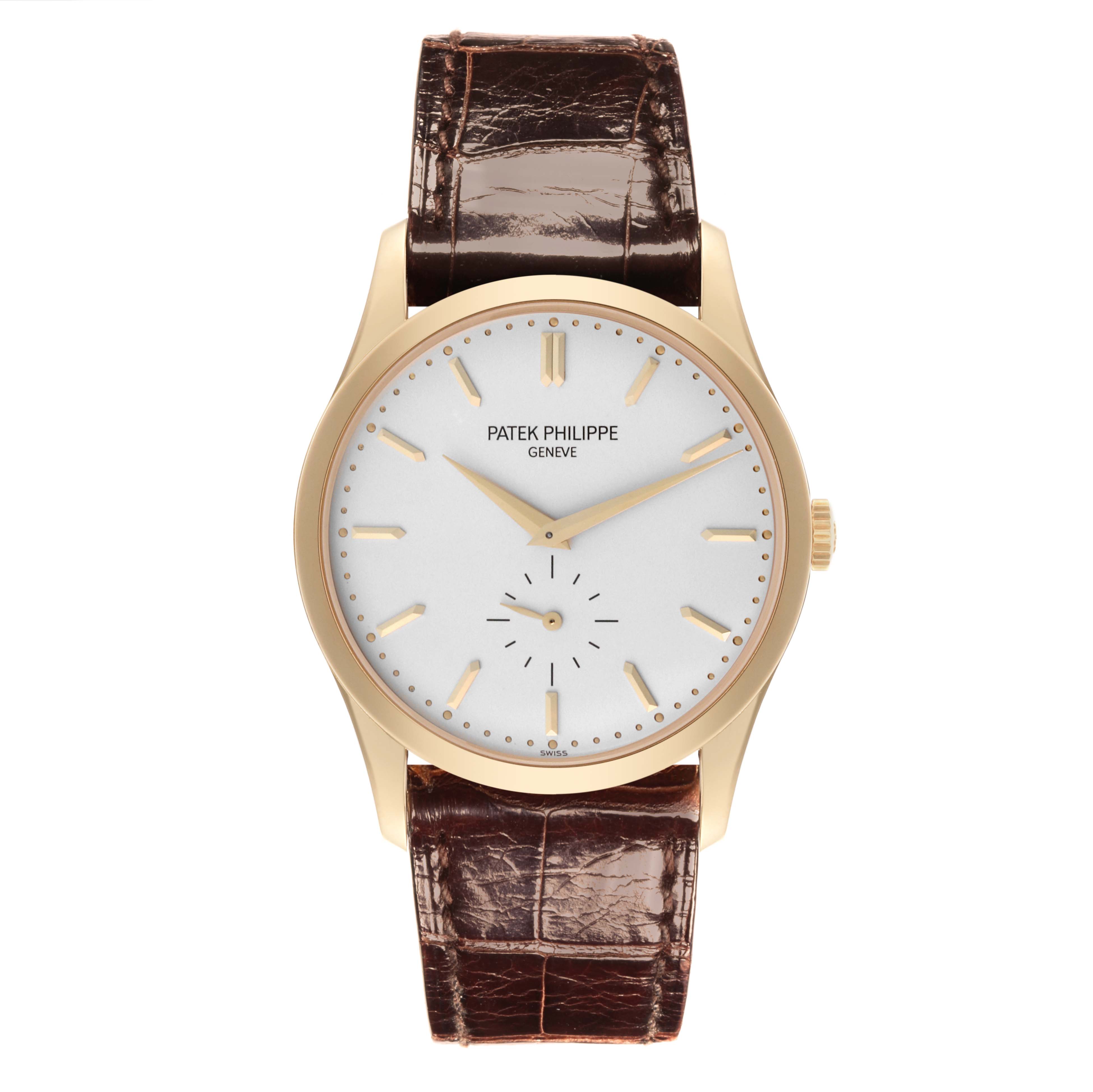 The Patek Philippe Calatrava 5196J-001 Men's Yellow Gold Silver Dial 5196J-001 Men's Yellow Gold Silver Dial watch is shown from the front, displaying the face, hands, case, and strap.