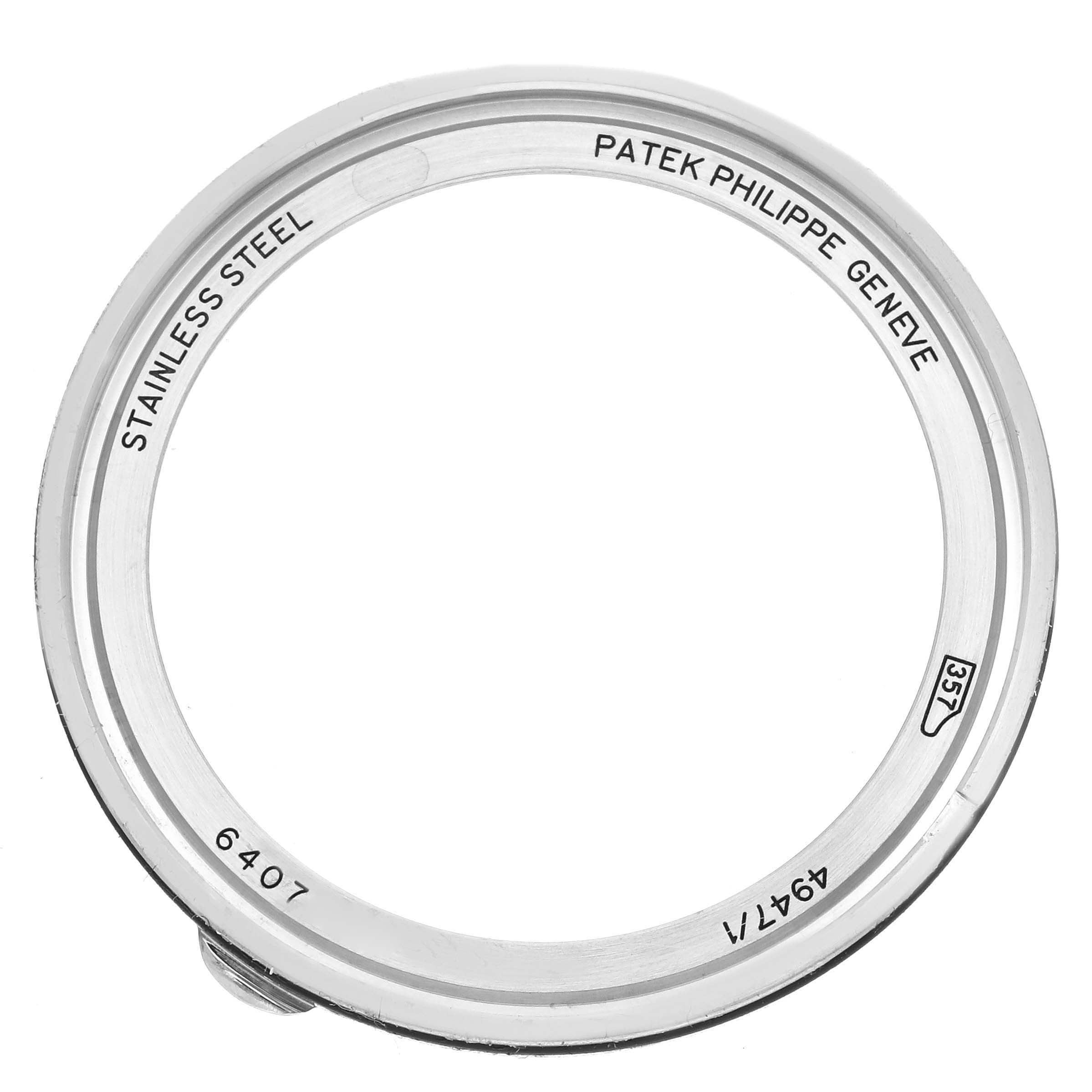 The image shows the stainless steel bezel of a Patek Philippe Complications 4947/1A-001 Men's Stainless Steel Blue Dial 4947/1A-001 Men's Stainless Steel Blue Dial watch, viewed from the side.