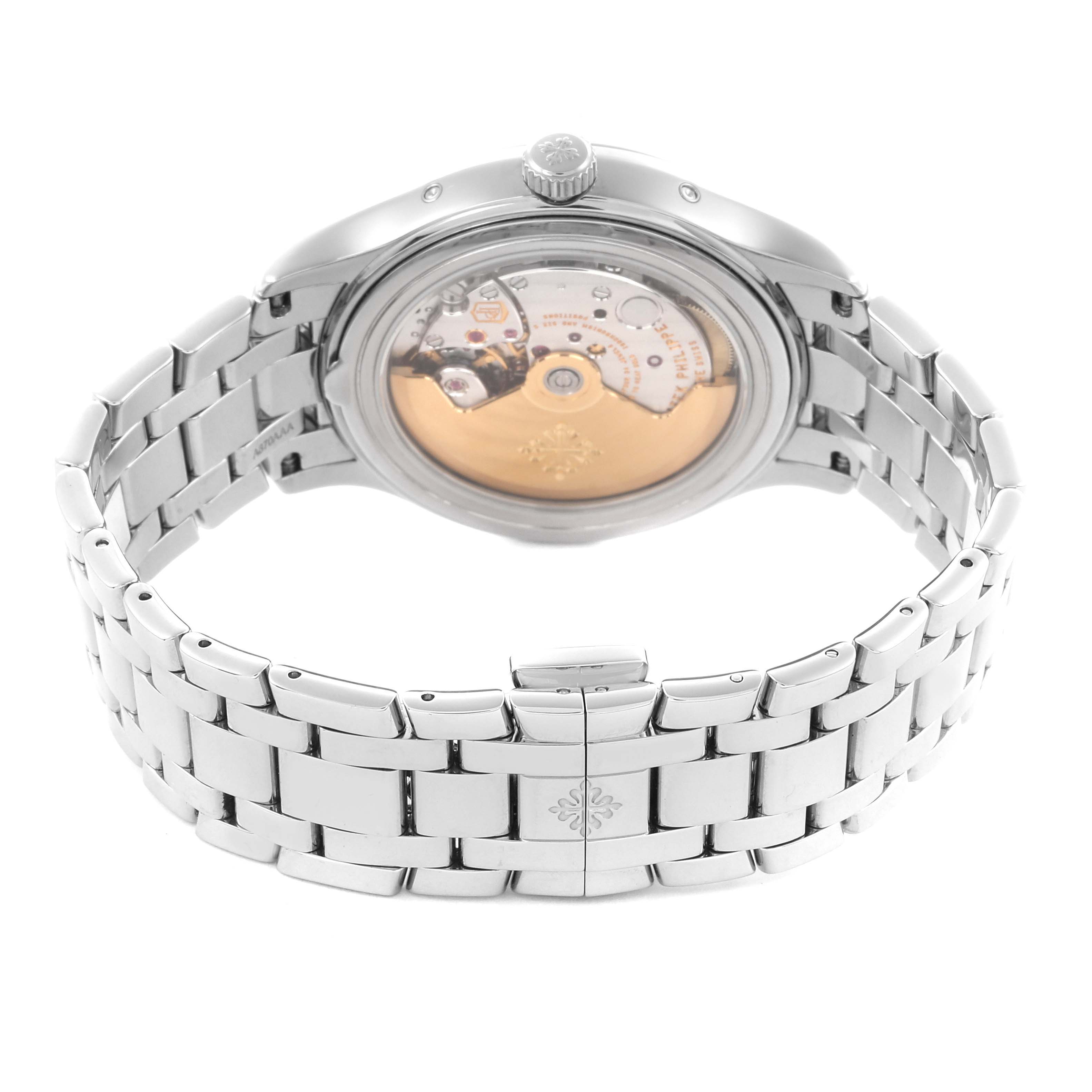 The image shows the back view of the Patek Philippe Complications 4947/1A-001 Men's Stainless Steel Blue Dial 4947/1A-001 Men's Stainless Steel Blue Dial watch, highlighting its movement and bracelet.