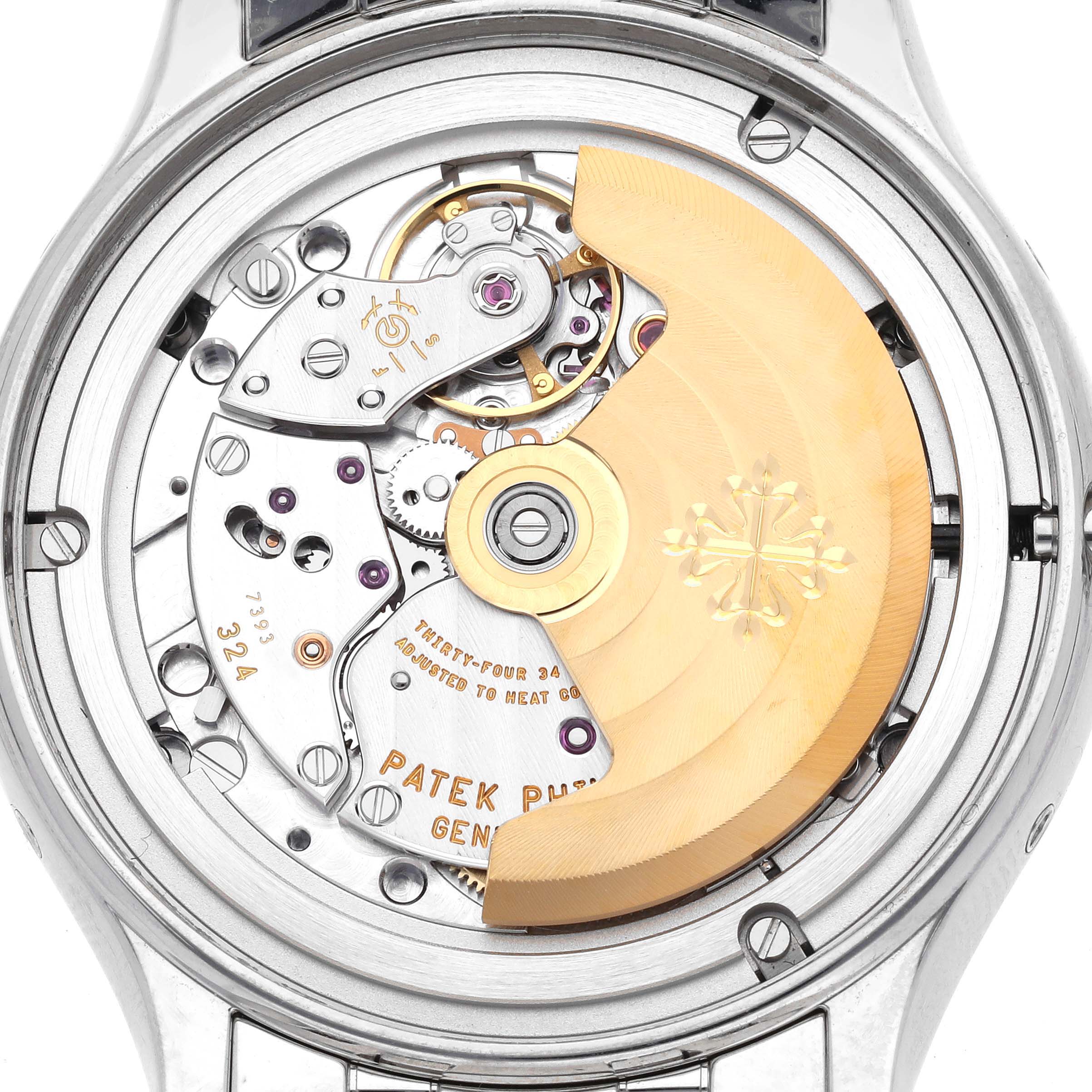 The image shows the back view of a Patek Philippe Complications 4947/1A-001 Men's Stainless Steel Blue Dial 4947/1A-001 Men's Stainless Steel Blue Dial watch, highlighting its intricate mechanical movement.