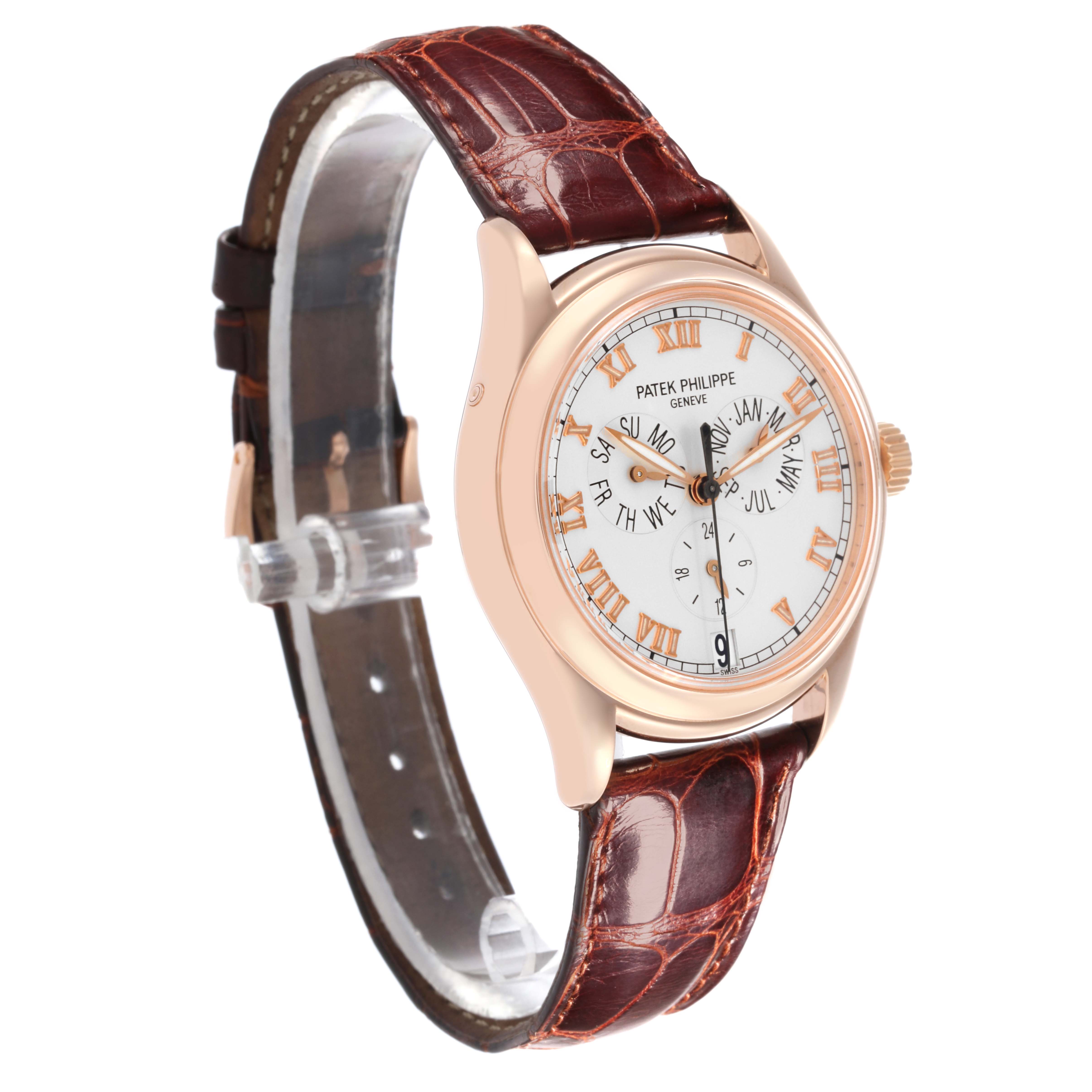 The Patek Philippe Complications 5035R-001 Men
s Rose Gold Silver Dial 5035R-001 Men
s Rose Gold Silver Dial watch is shown from a front-side angle, highlighting the dial, case, and leather strap.