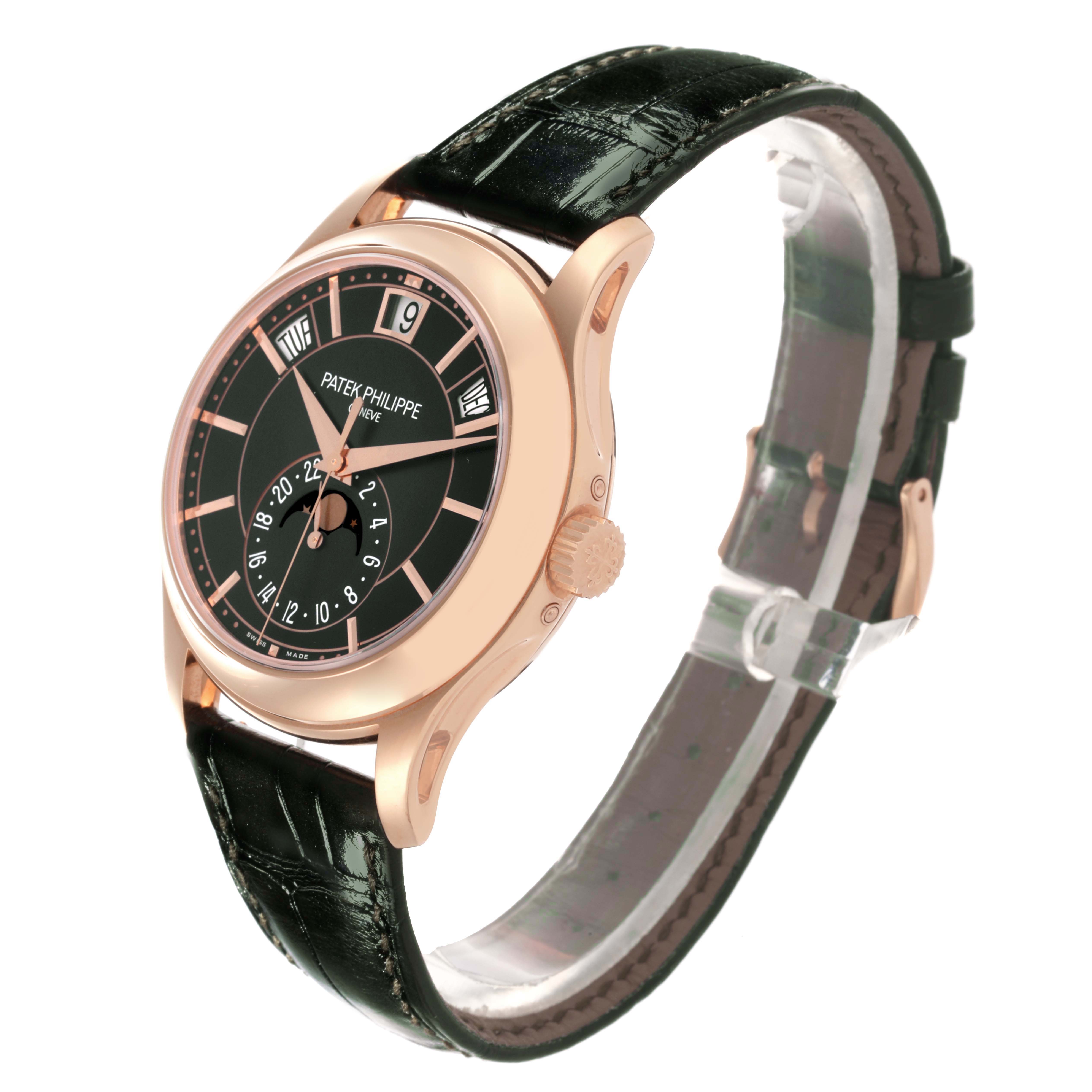 The Patek Philippe Complications 5205R - 011 Men's Rose Gold Green Dial 5205R - 011 Men's Rose Gold Green Dial watch is shown at an oblique angle, highlighting the face, case, and leather strap.
