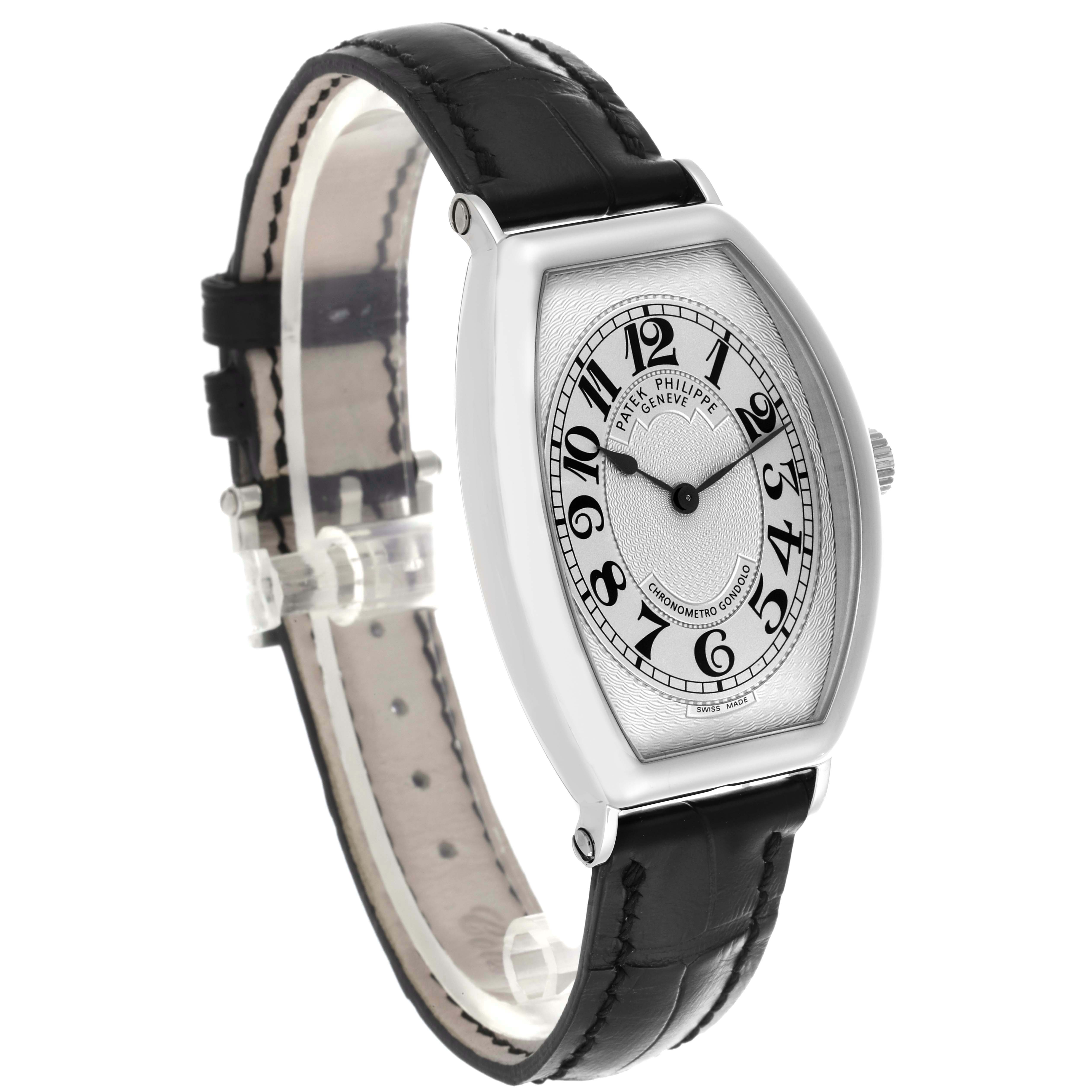 The Patek Philippe Gondolo 5098P-001 Men's Platinum Silver Dial 5098P-001 Men's Platinum Silver Dial watch is shown from a three-quarter view, highlighting the case, dial, and leather strap.