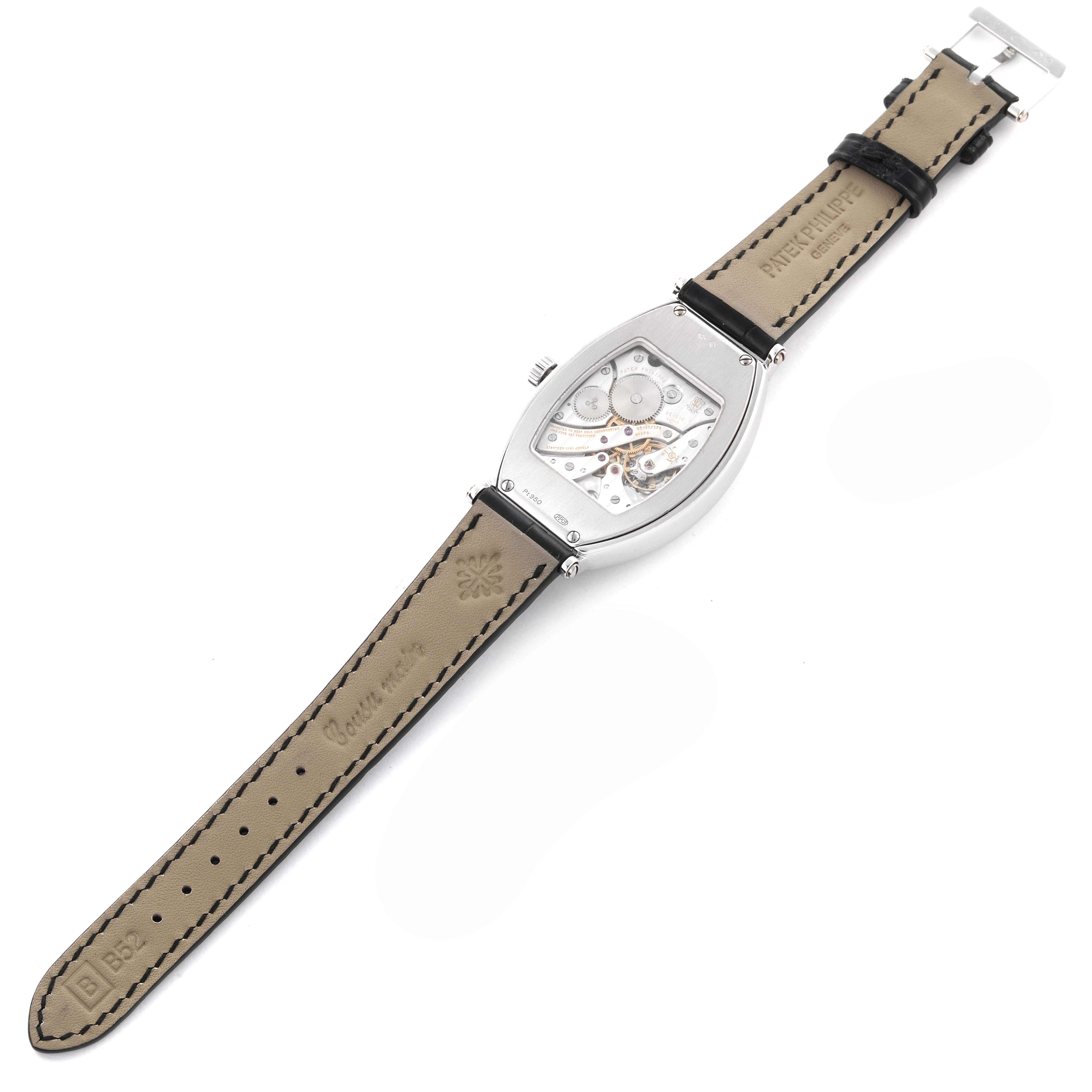 The Patek Philippe Gondolo 5098P-001 Men's Platinum Silver Dial 5098P-001 Men's Platinum Silver Dial watch is shown from the back, displaying its movement and leather strap.