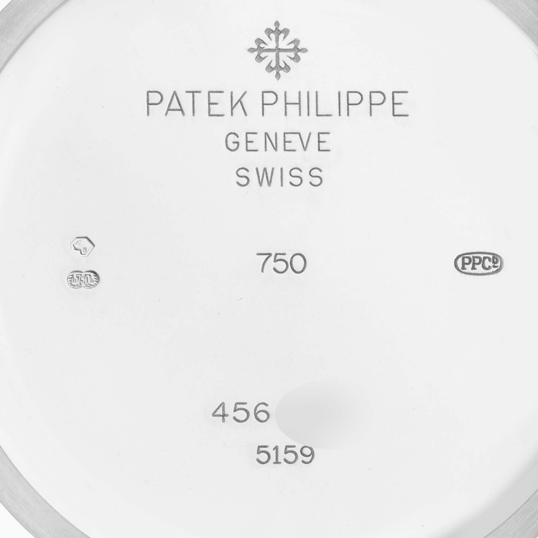 The image shows the back case of a Patek Philippe Complications 5159G-001 Men's White Gold White Dial 5159G-001 Men's White Gold White Dial model with engraved details and branding.
