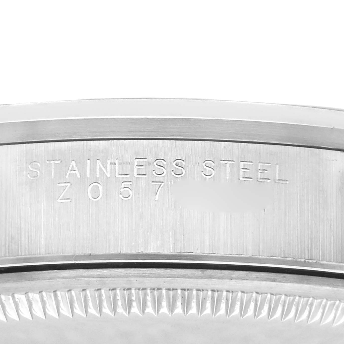The image shows a close-up of the case side edge of the Rolex Air-King 14000M Men's Stainless Steel Black Dial 14000M Men's Stainless Steel Black Dial, displaying "STAINLESS STEEL" text engraving.