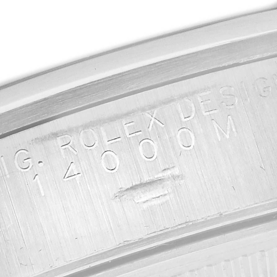 The image shows a close-up of the engraved inner bezel of a Rolex Air-King 14000M Men's Stainless Steel White Dial 14000M Men's Stainless Steel White Dial watch.