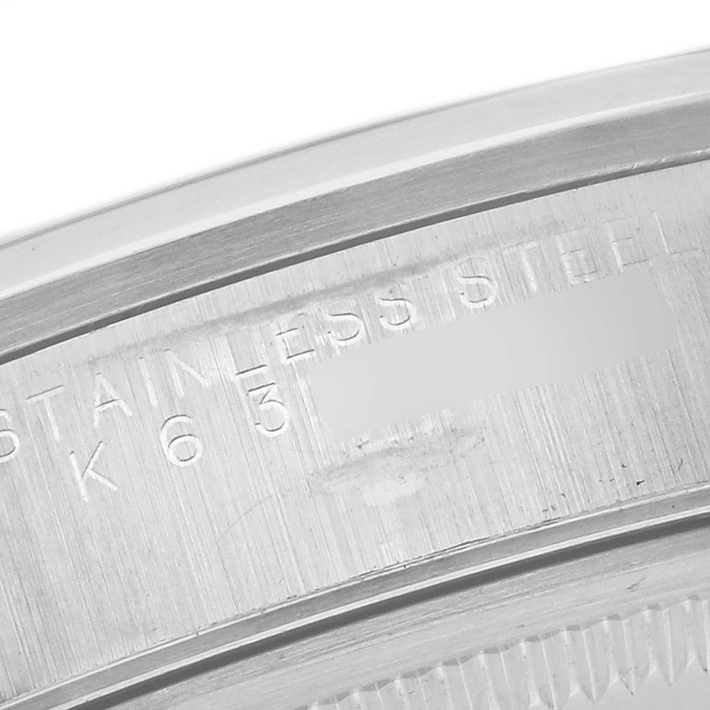 The image shows the engraving on the stainless steel back of a Rolex Air-King 14000M Men's Stainless Steel White Dial 14000M Men's Stainless Steel White Dial watch.