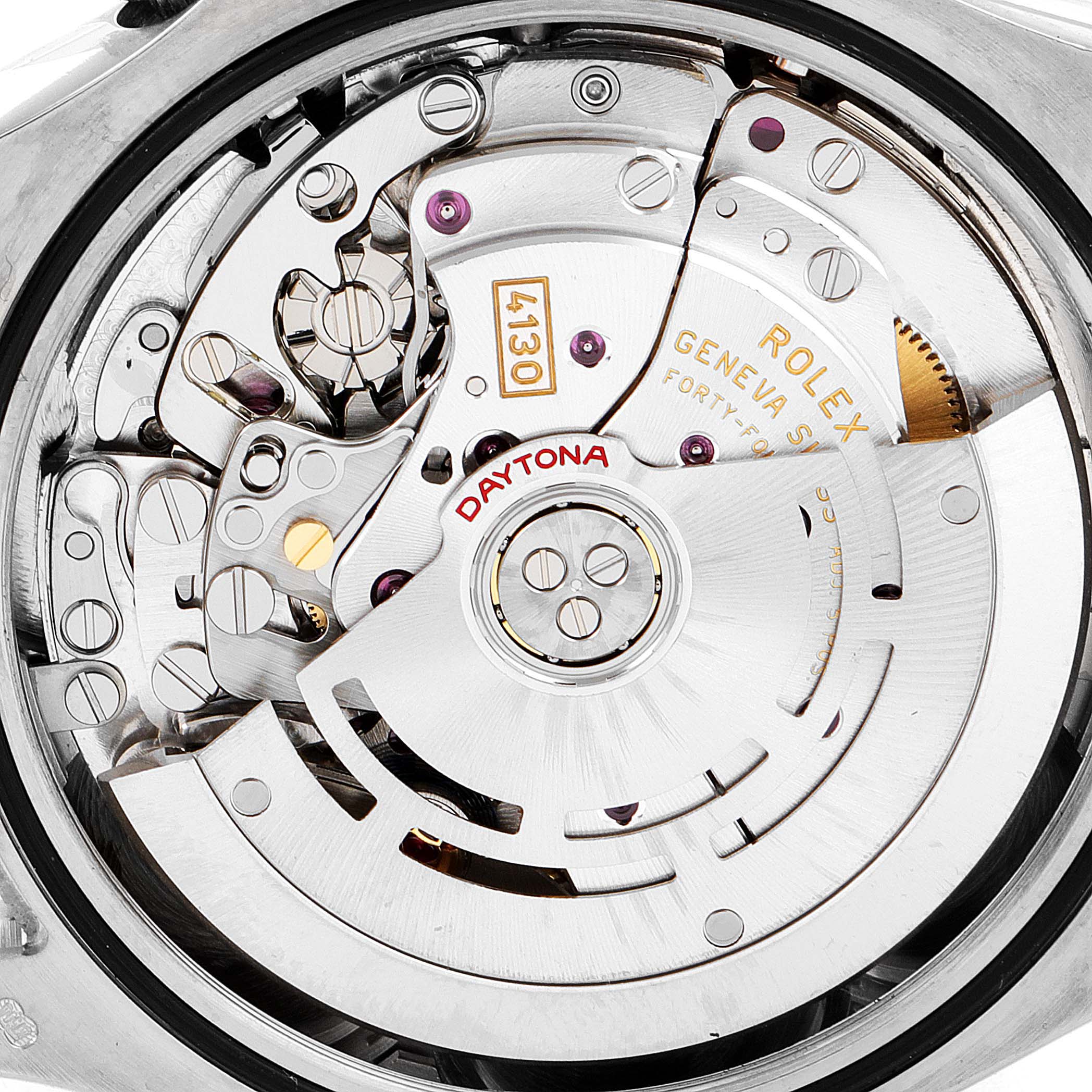 The image shows a close-up of the movement mechanism of a Rolex Daytona 116509 Men's White Gold Grey Dial 116509 Men's White Gold Grey Dial watch, highlighting intricate gears and components.