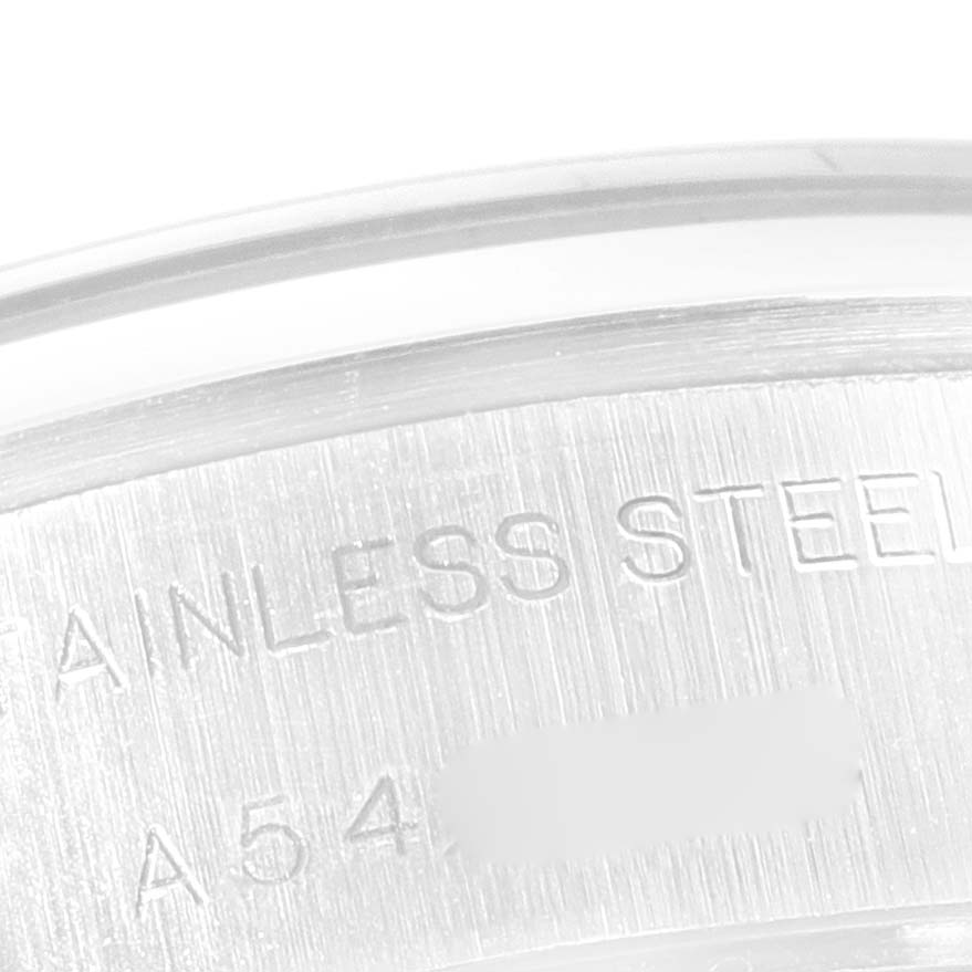 This close-up image shows the inner caseback of a stainless steel Rolex Date 79160 Women
s Stainless Steel Blue Dial 79160 Women
s Stainless Steel Blue Dial model watch with partial serial number visible.