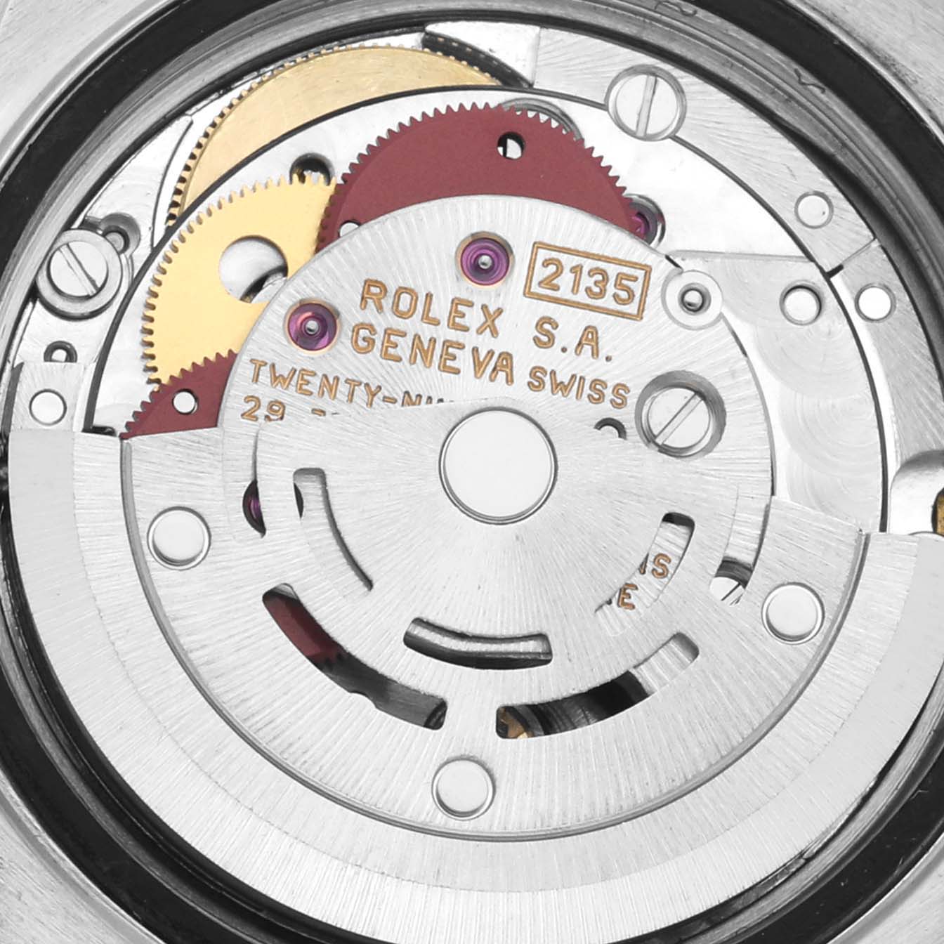 The image shows a close-up of the Rolex Date 69160 Women
s Stainless Steel White Dial 69160 Women
s Stainless Steel White Dial model
s movement, highlighting gears and engravings.