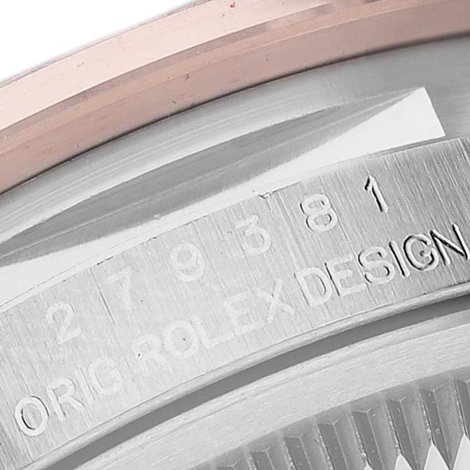 This image shows a close-up of the case with engraved serial and model numbers of a Rolex Datejust 279381RBR Women's Steel and Gold (two tone) Brown Dial 279381RBR Women's Steel and Gold (two tone) Brown Dial watch.