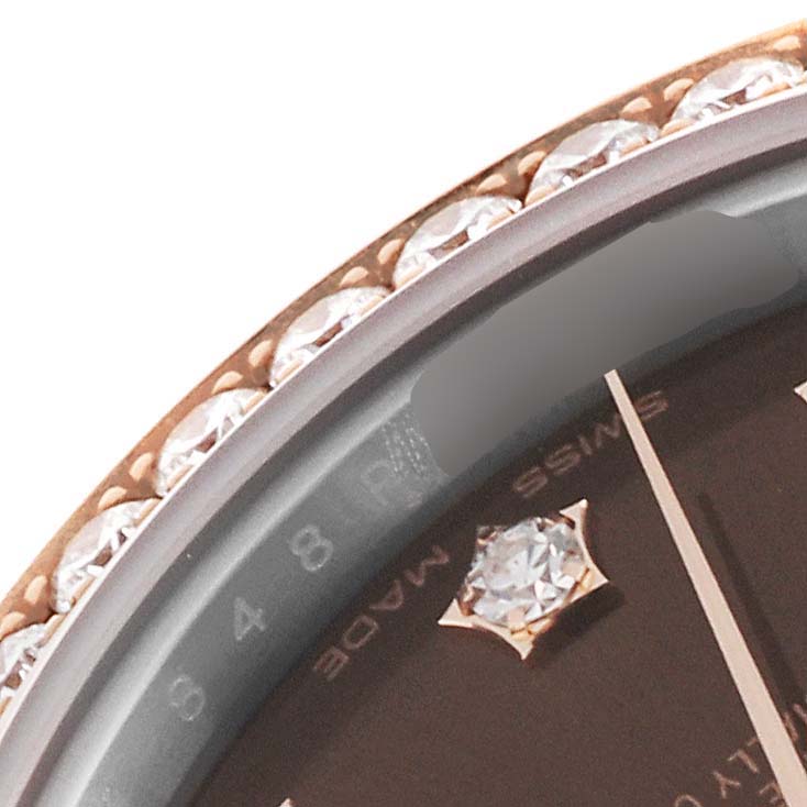 The image shows a close-up of the bezel with diamonds and a portion of the dial of a Rolex Datejust 279381RBR Women's Steel and Gold (two tone) Brown Dial 279381RBR Women's Steel and Gold (two tone) Brown Dial watch.