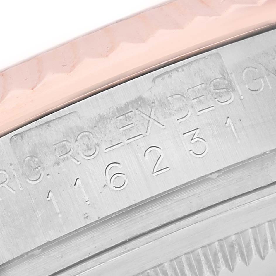 The image shows a close-up of the engraved case edge and part of the bezel on a Rolex Datejust 116231 Men's Steel and Gold (two tone) Silver Dial 116231 Men's Steel and Gold (two tone) Silver Dial watch.