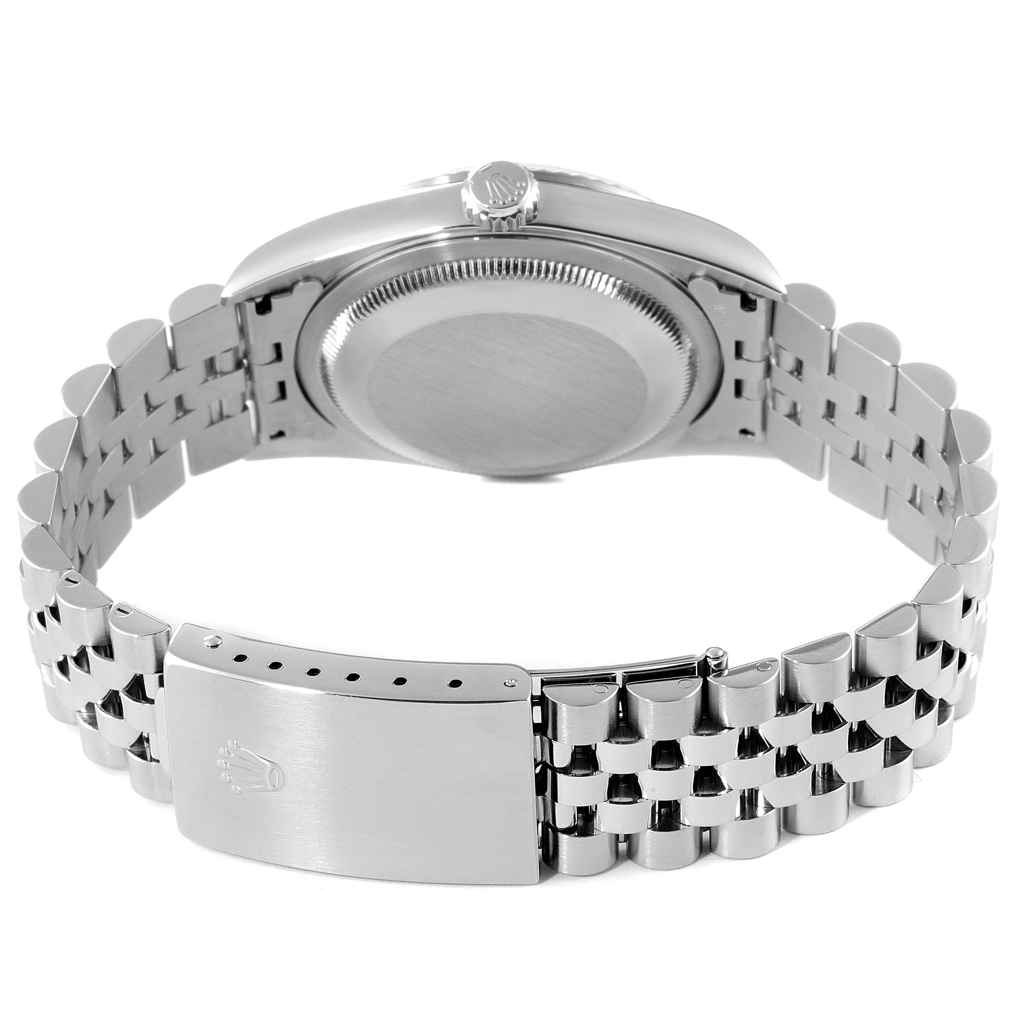 This image shows the back view of a Rolex Datejust 16234 Men's Stainless Steel Silver Dial 16234 Men's Stainless Steel Silver Dial watch, highlighting its case back, crown, and metal bracelet with clasp.