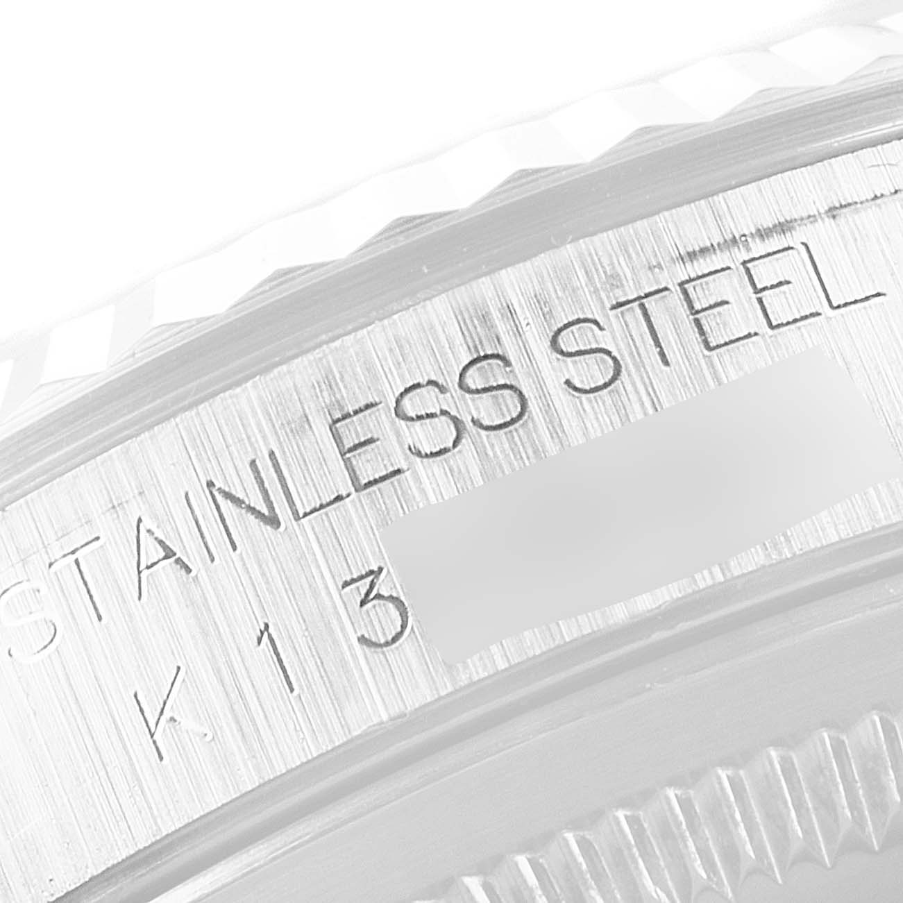 The image shows a close-up of the back case and serial engraving of a Rolex Datejust 16234 Men's Stainless Steel Silver Dial 16234 Men's Stainless Steel Silver Dial watch.