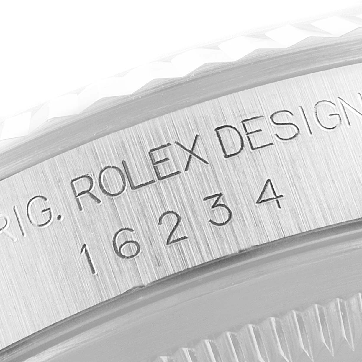 This close-up image shows the engraved model number and design markings on the case side of a Rolex Datejust 16234 Men's Stainless Steel Silver Dial 16234 Men's Stainless Steel Silver Dial watch.
