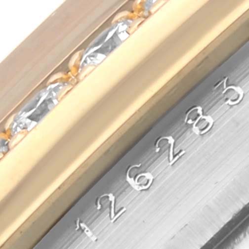 The image shows a close-up view of the watch case and bezel of the Rolex Datejust 126283RBR Men's Steel and Gold (two tone) Champagne Dial 126283RBR Men's Steel and Gold (two tone) Champagne Dial, focusing on the serial number.