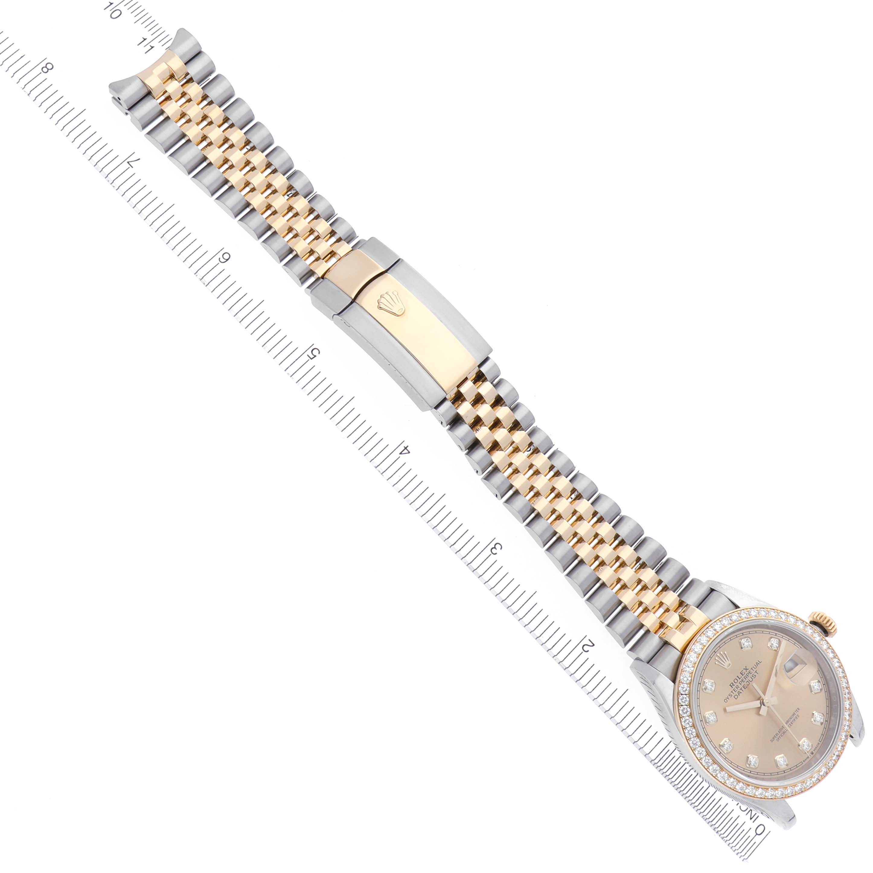 The Rolex Datejust 126283RBR Men's Steel and Gold (two tone) Champagne Dial 126283RBR Men's Steel and Gold (two tone) Champagne Dial watch is displayed from an overhead angle, showing the face, two-tone bracelet, and clasp.