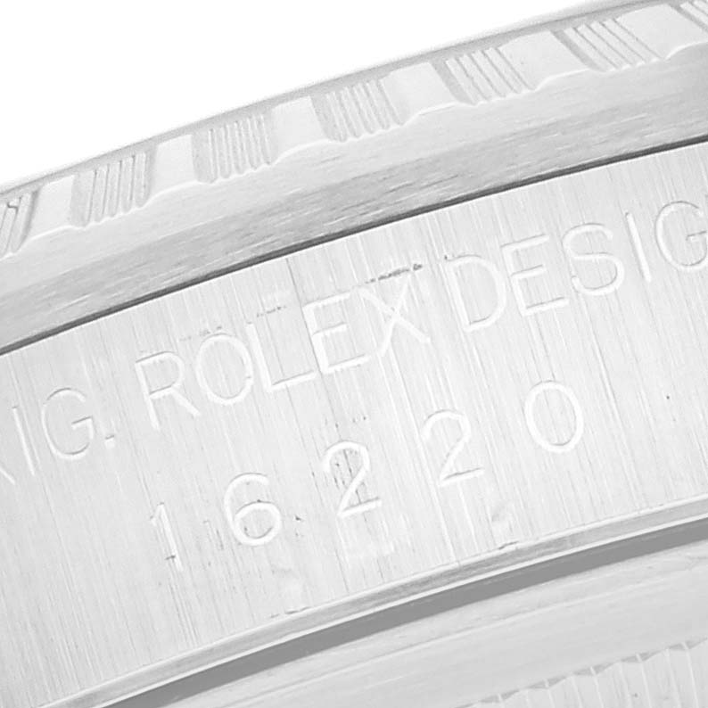 The image shows an angled close-up of the engraved reference number and design details on the bezel and case of a Rolex Datejust 16220 Men's Stainless Steel White Dial 16220 Men's Stainless Steel White Dial model.