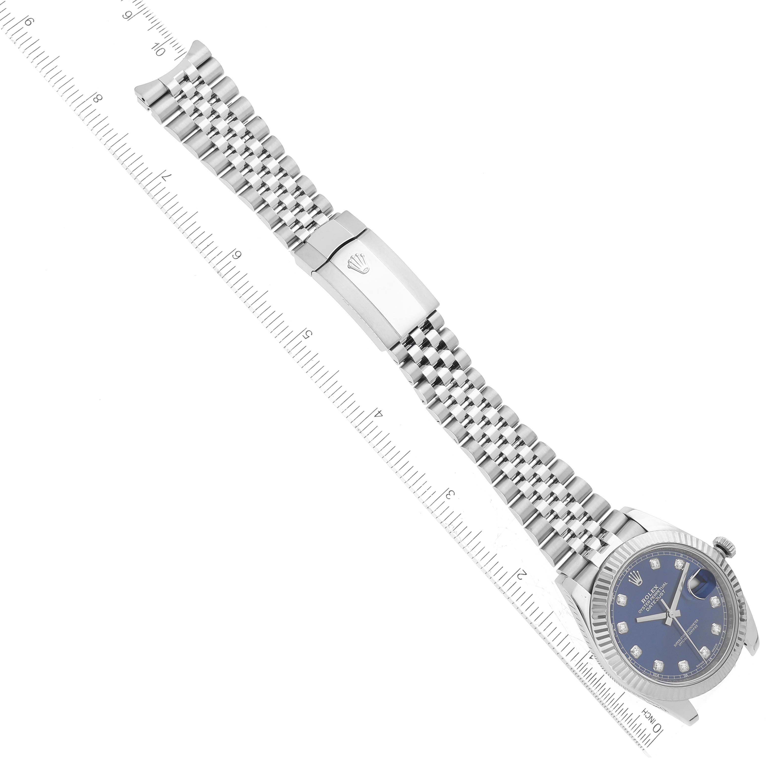 The image shows a Rolex Datejust 41 126334 Men
s Stainless Steel Blue Dial 126334 Men
s Stainless Steel Blue Dial watch laid flat, highlighting its dial, bezel, and Jubilee bracelet with clasp.