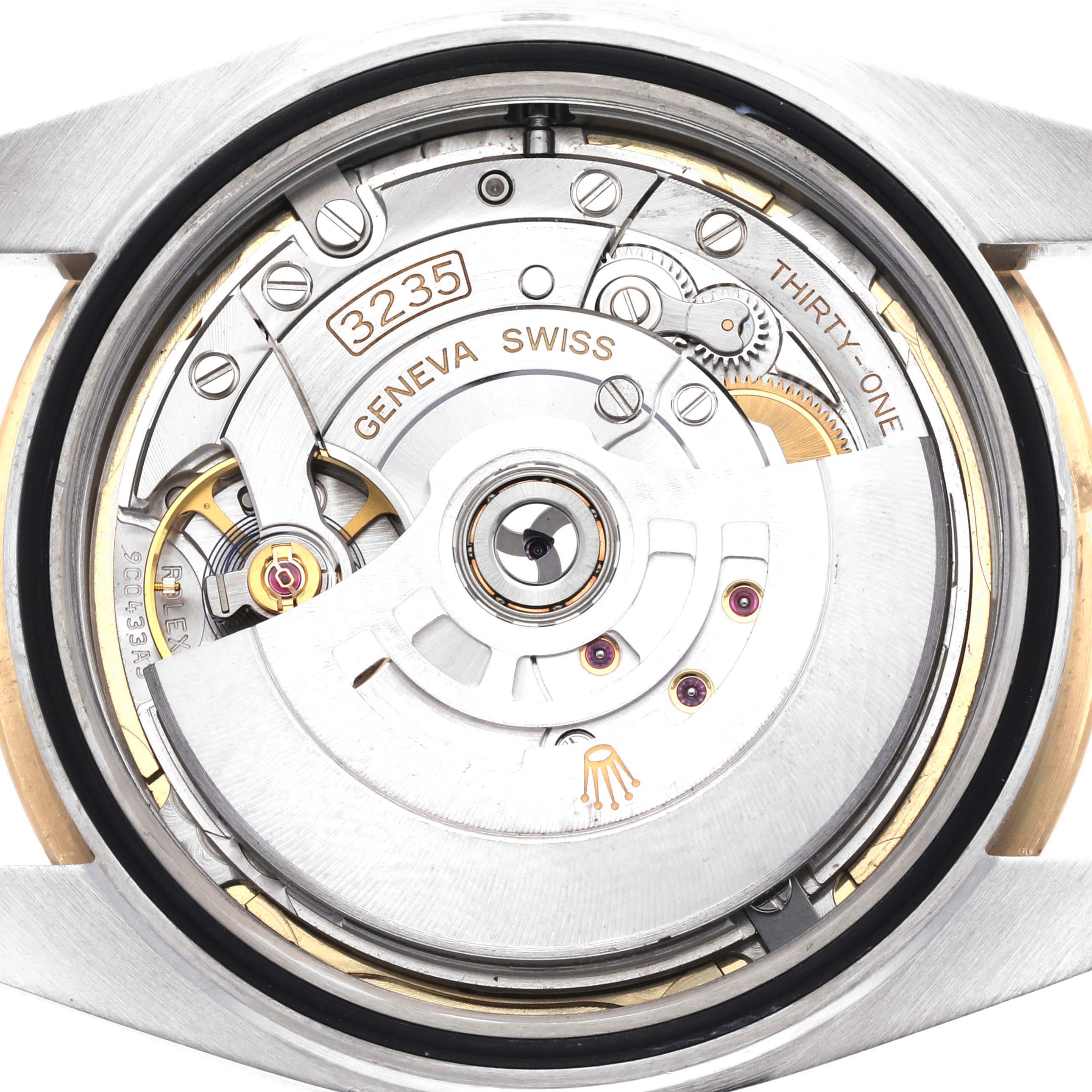 This image shows a close-up of the movement from the back of a Rolex Datejust 41 126333 Men's Steel and Gold (two tone) Champagne Dial 126333 Men's Steel and Gold (two tone) Champagne Dial, highlighting its inner mechanisms and markings.