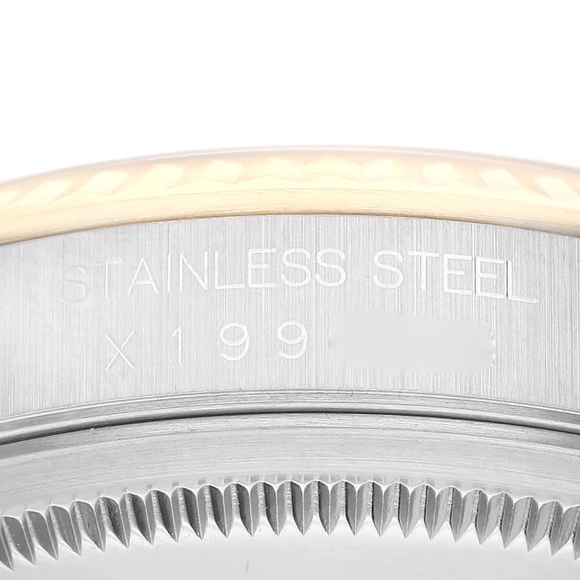 This image shows a close-up of the Rolex Datejust 16233 Men's Steel and Gold (two tone) Champagne Dial 16233 Men's Steel and Gold (two tone) Champagne Dial watch's case side, highlighting the stainless steel material and serial number.