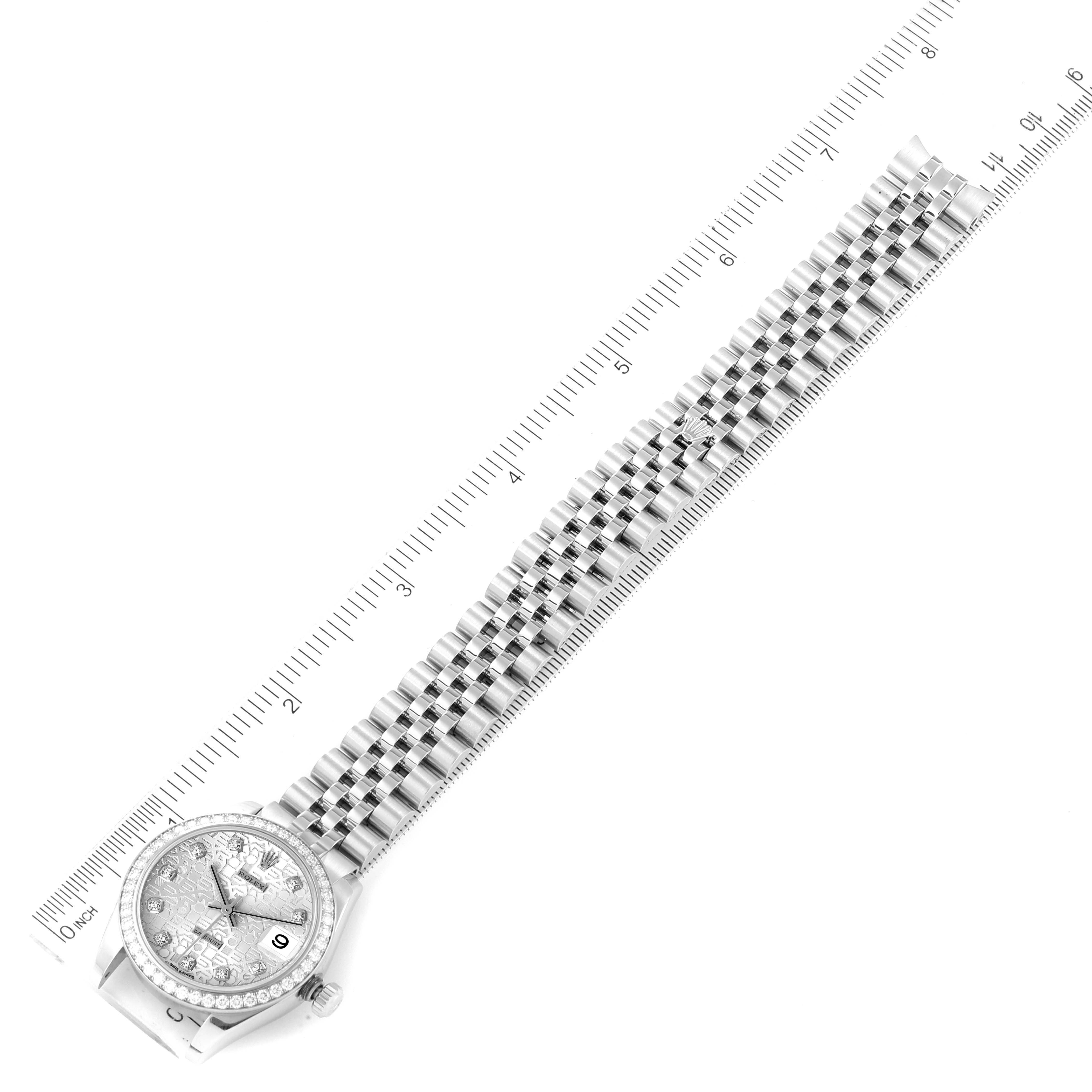 The image shows the full face and stainless steel bracelet of a Rolex Mid-Size 178384 Women's Stainless Steel Silver Dial 178384 Women's Stainless Steel Silver Dial watch from an overhead angle against a ruler.