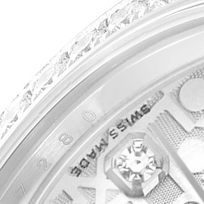This close-up image of a Rolex Mid-Size 178384 Women's Stainless Steel Silver Dial 178384 Women's Stainless Steel Silver Dial watch shows part of the bezel and dial with text reading "SWISS MADE."