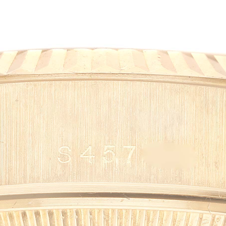 This close-up image shows the serial number engraved on the side of the Rolex President 69178G Women
s Yellow Gold Champagne Dial 69178G Women
s Yellow Gold Champagne Dial model watch.
