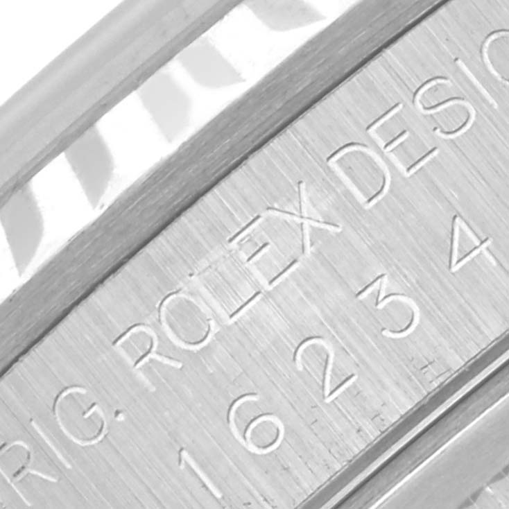 The image shows a close-up of the serial number and engraving on the case side of a Rolex Datejust 16234G Men's Stainless Steel Mother of Pearl Dial 16234G Men's Stainless Steel Mother of Pearl Dial watch.