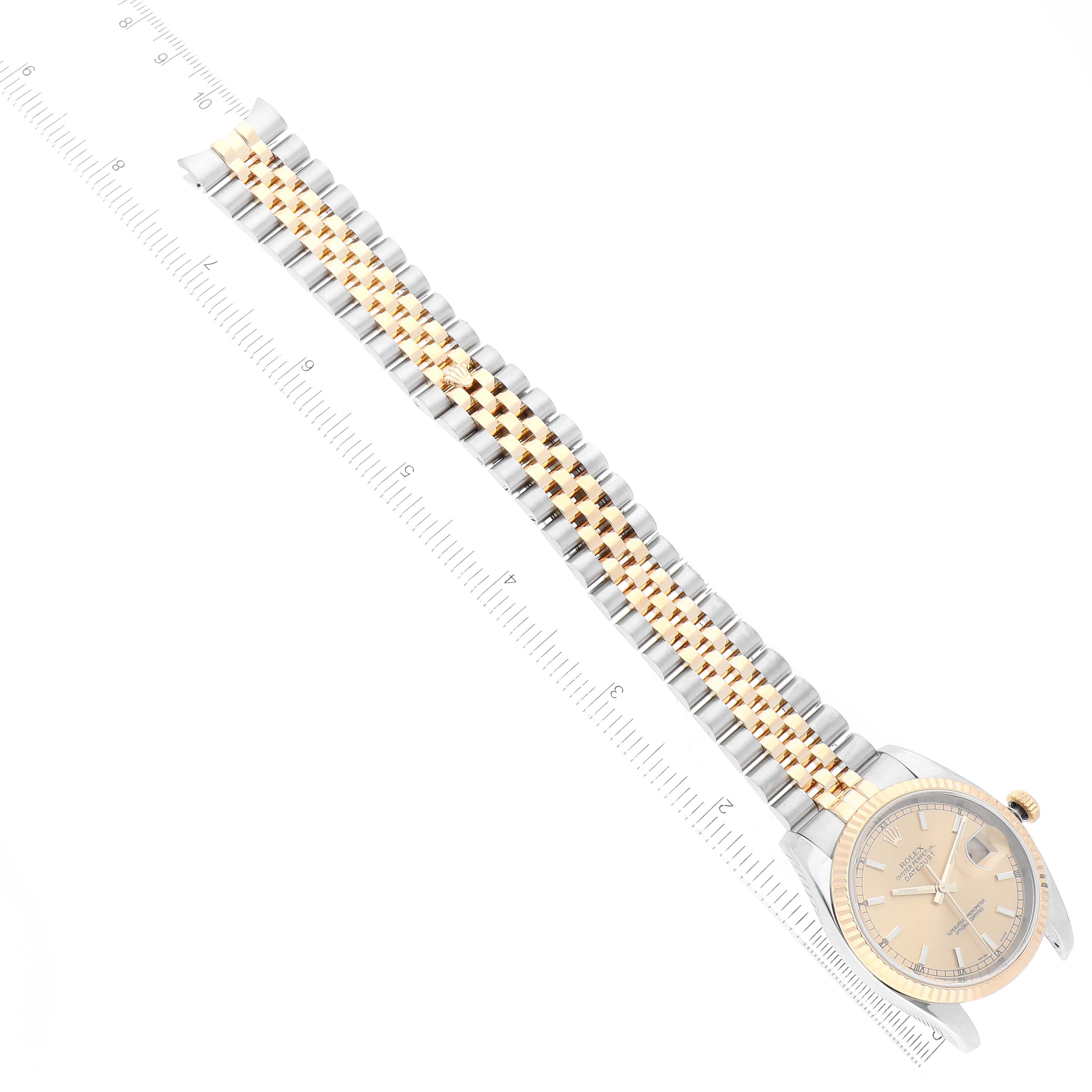 This image shows a Rolex Datejust 116233 Men's Steel and Gold (two tone) Champagne Dial 116233 Men's Steel and Gold (two tone) Champagne Dial watch from a top-down angle, highlighting the dial and the Jubilee bracelet.