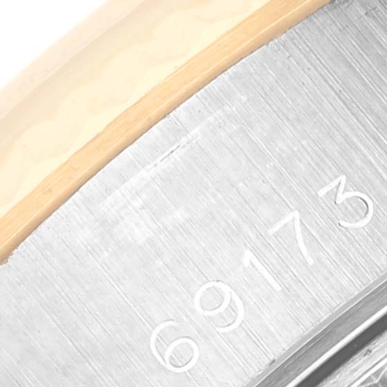 This image shows a close-up of the model number "69173" engraved on the case of the Rolex Datejust 69173 Women's Steel and Gold (two tone) Champagne Dial 69173 Women's Steel and Gold (two tone) Champagne Dial watch.