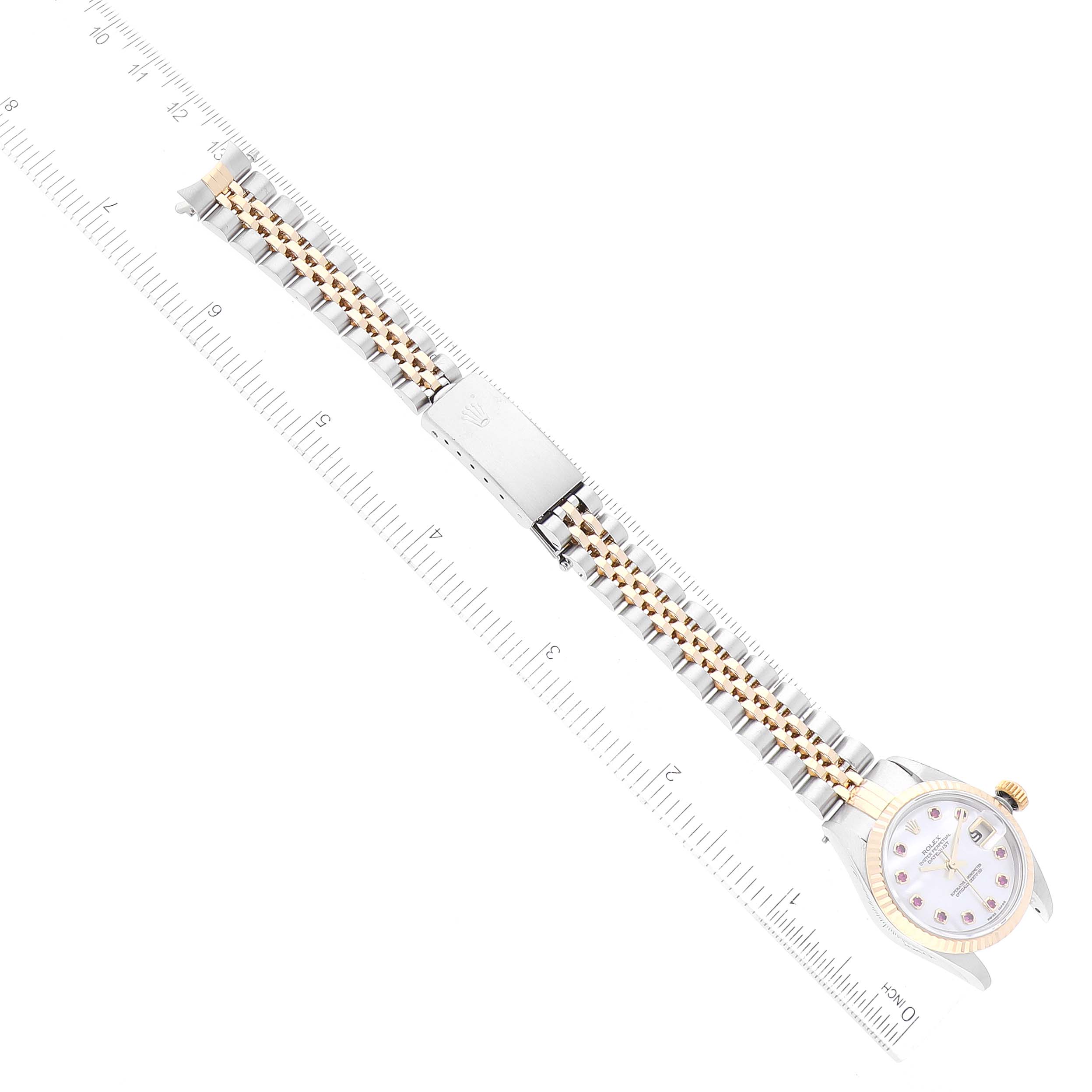 The image shows a top-down view of a Rolex Datejust 79173NGR Women's Steel and Gold (two tone) Mother of Pearl Dial 79173NGR Women's Steel and Gold (two tone) Mother of Pearl Dial watch, including its face, band, and clasp.
