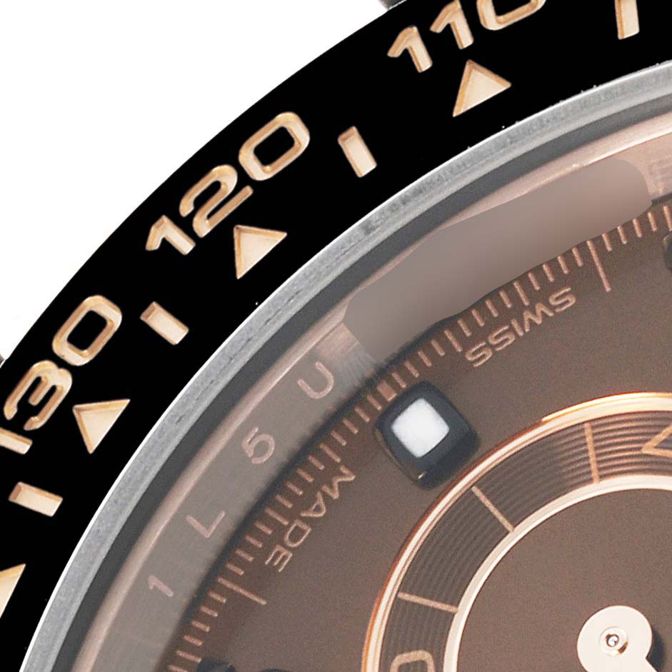 The image shows a close-up of the bezel and dial edge of a Rolex Daytona 116515LN Men's Rose Gold Brown Dial 116515LN Men's Rose Gold Brown Dial watch, featuring numbers and part of the face.