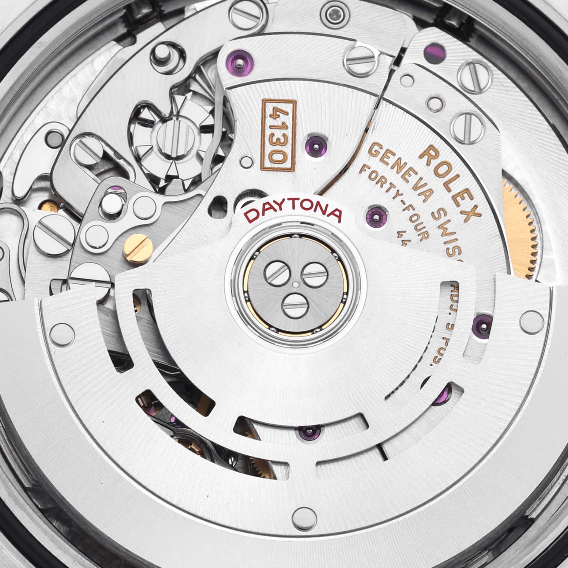 The image shows a close-up view of the Rolex Daytona 116503 Men's Steel and Gold (two tone) Mother of Pearl Dial 116503 Men's Steel and Gold (two tone) Mother of Pearl Dial's movement, highlighting intricate gears and engravings.